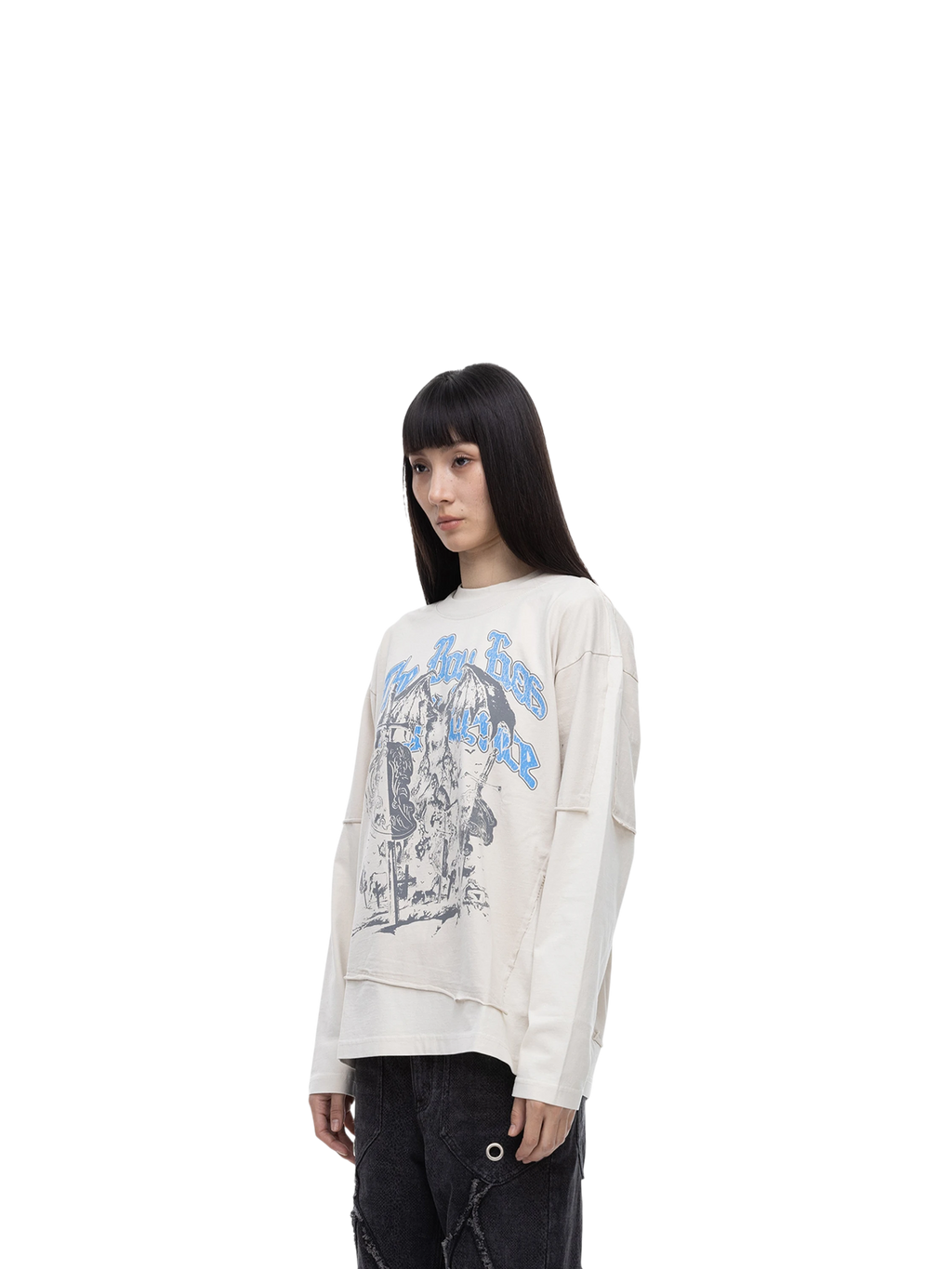 Female model styling TBHNP grayish-yellow knight long-sleeve tee, front detail — men's streetwear tee