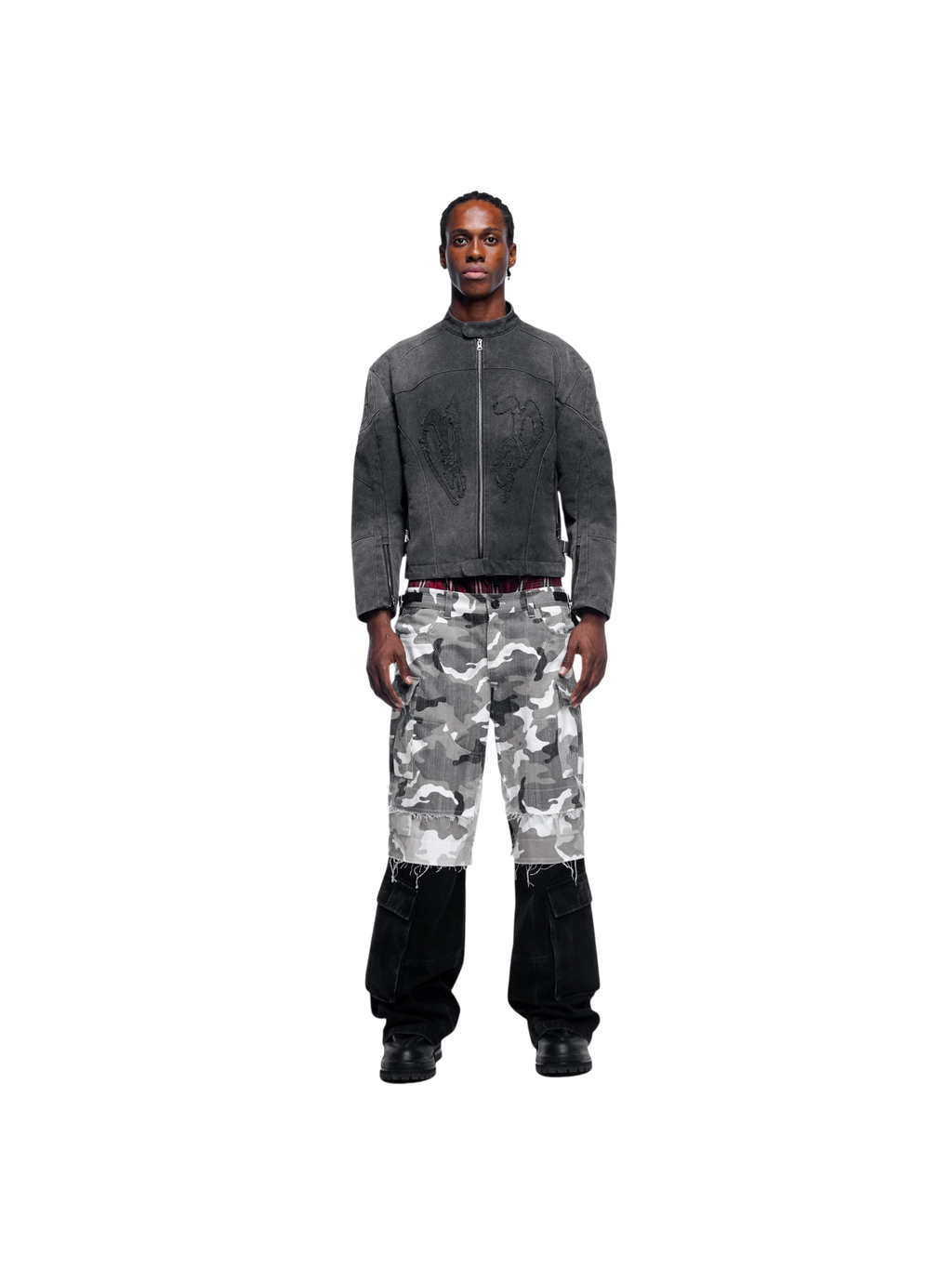 Model in TBHNP black canvas moto jacket with camo pants, full-length front — men's streetwear