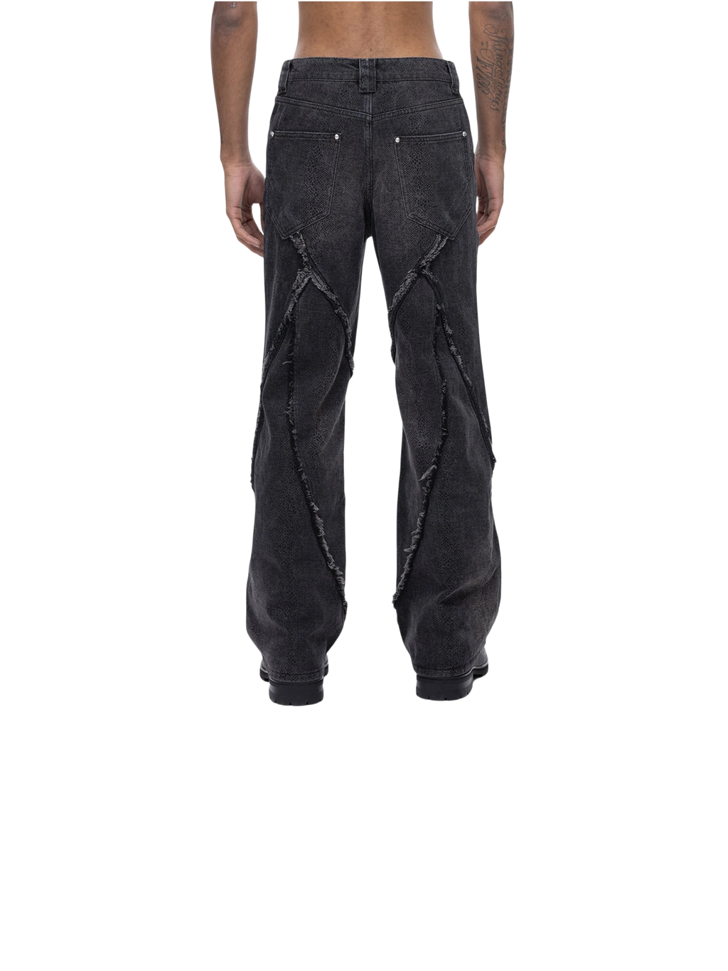 Model in TBHNP cobra print baggy jeans, front detail — men's streetwear denim