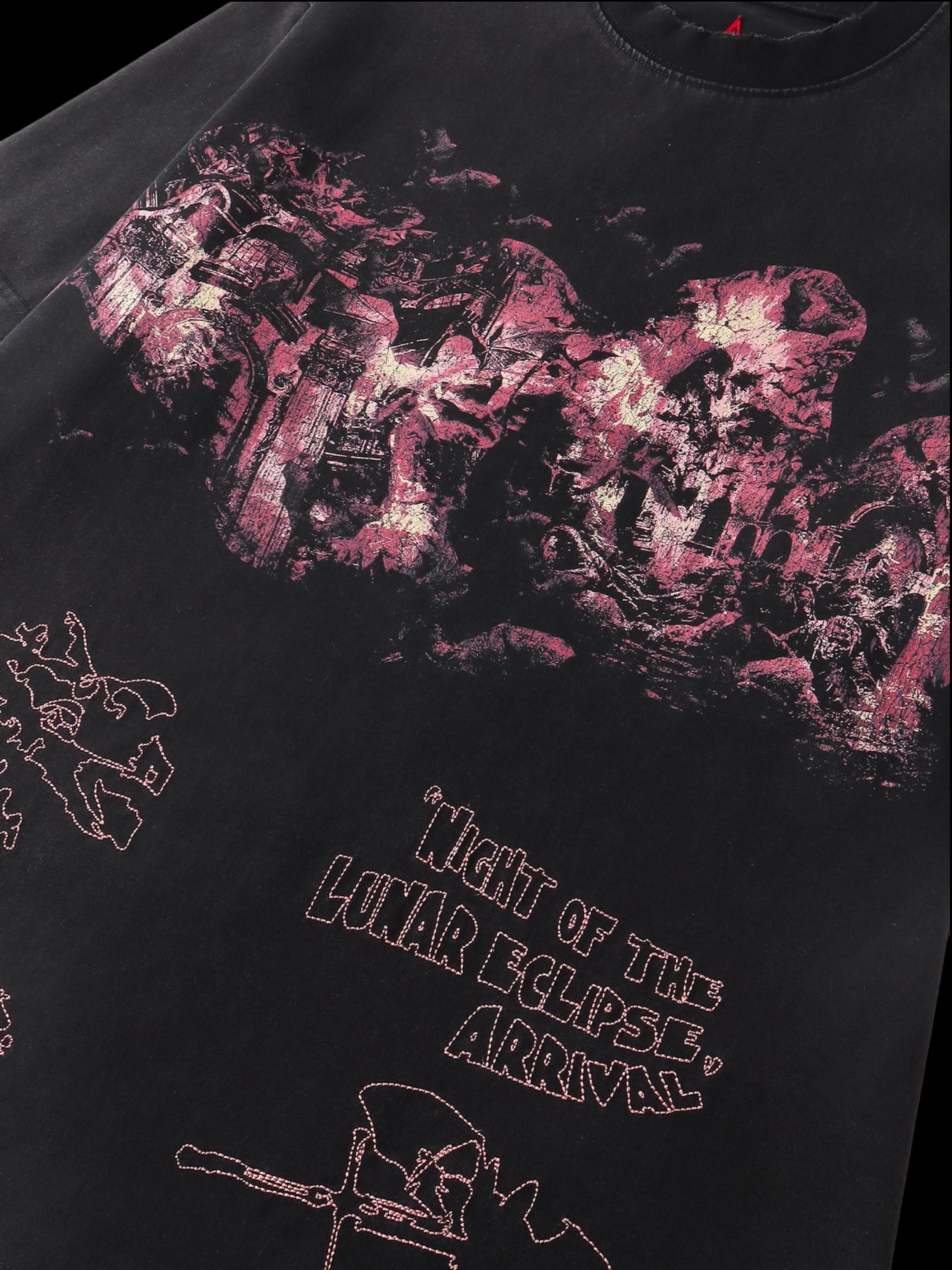 Close-up of the washed distressed print on TBHNP black arrival tee — men's streetwear detail