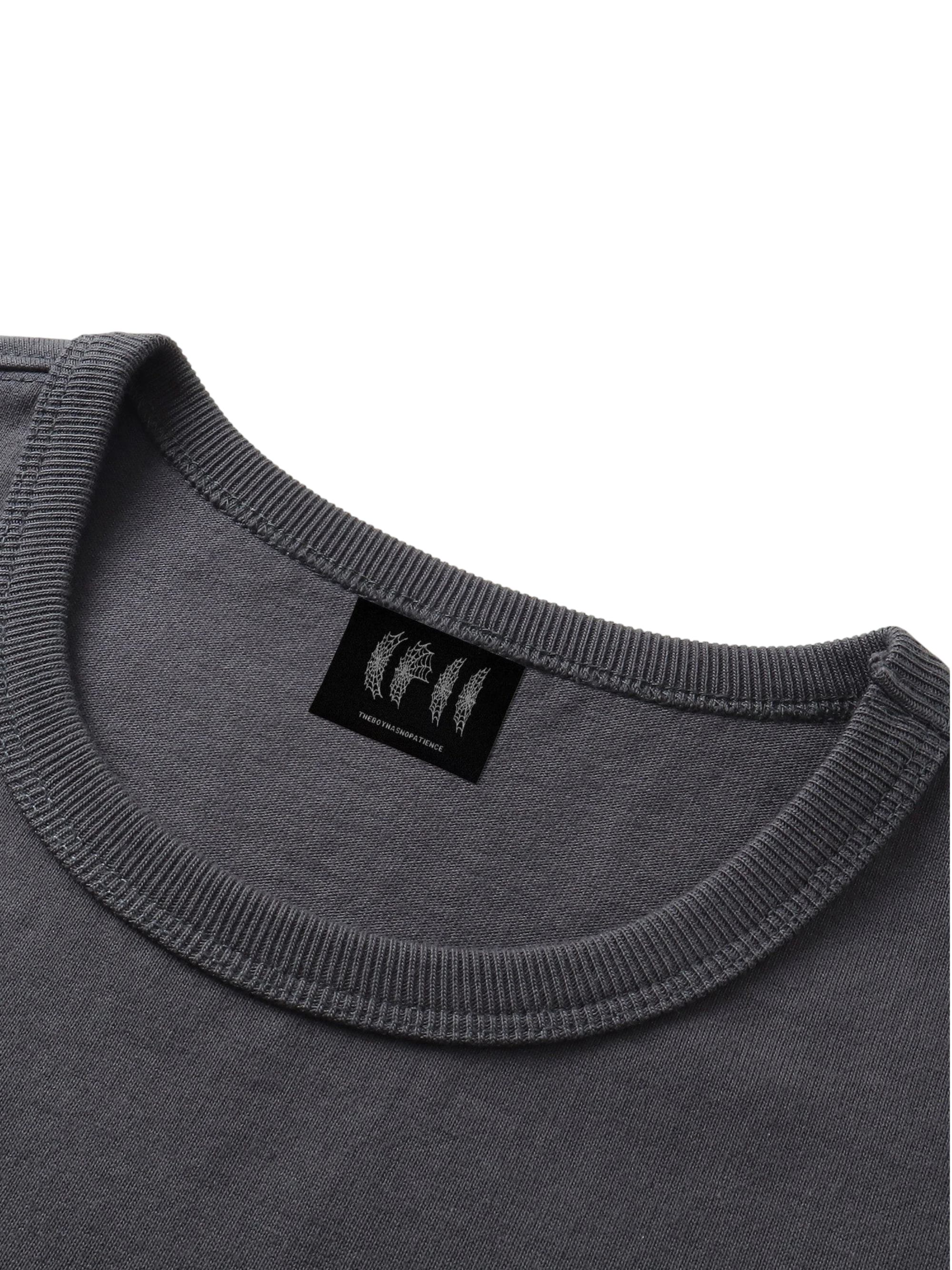Close-up of the armhole on TBHNP dark grey Shadowbat vest — men's streetwear detail