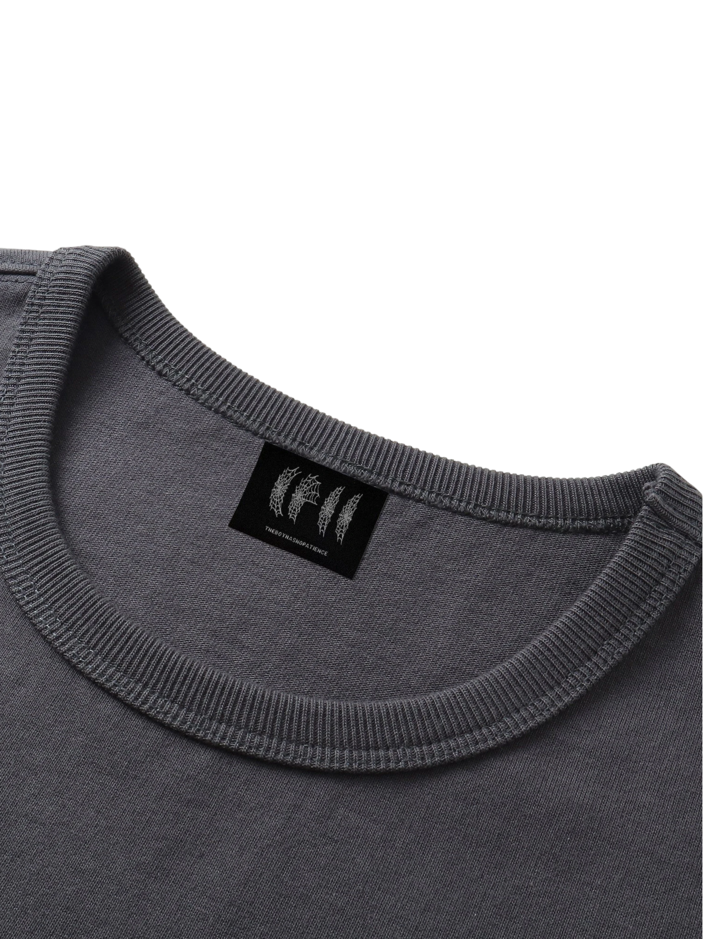 Close-up of the armhole on TBHNP dark grey Shadowbat vest — men's streetwear detail