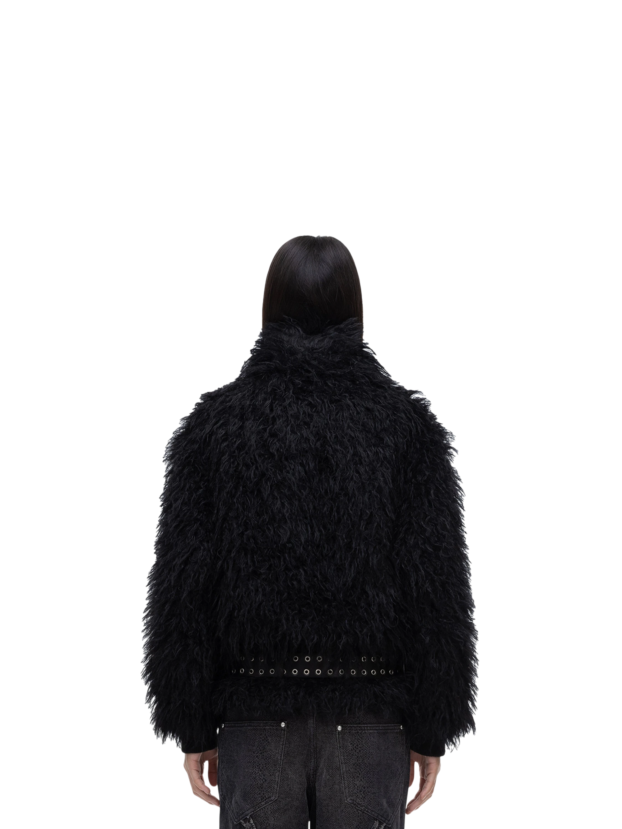 Model wearing TBHNP black faux-fur bomber with collar up, back view — men's streetwear jacket