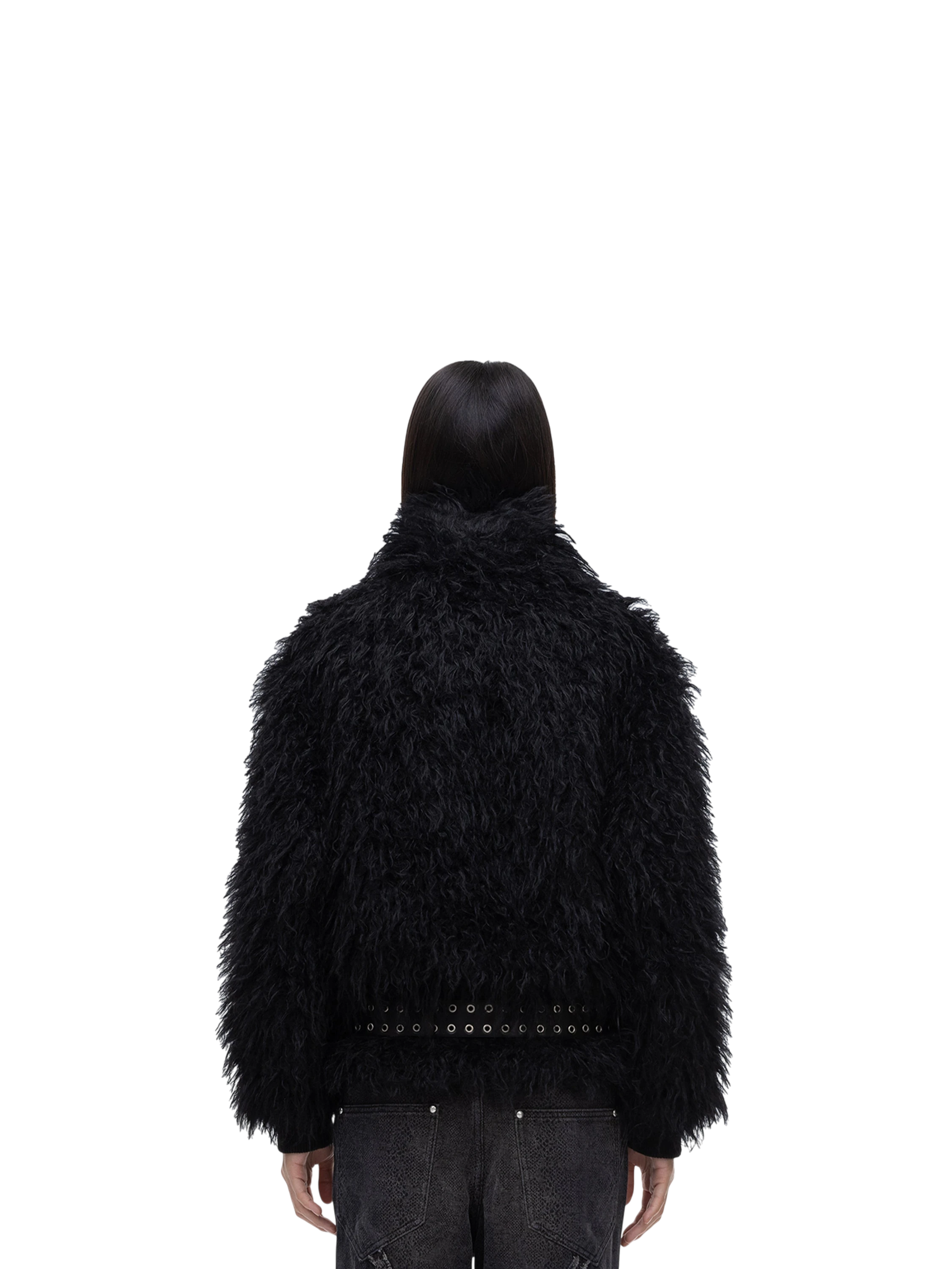 Model wearing TBHNP black faux-fur bomber with collar up, back view — men's streetwear jacket