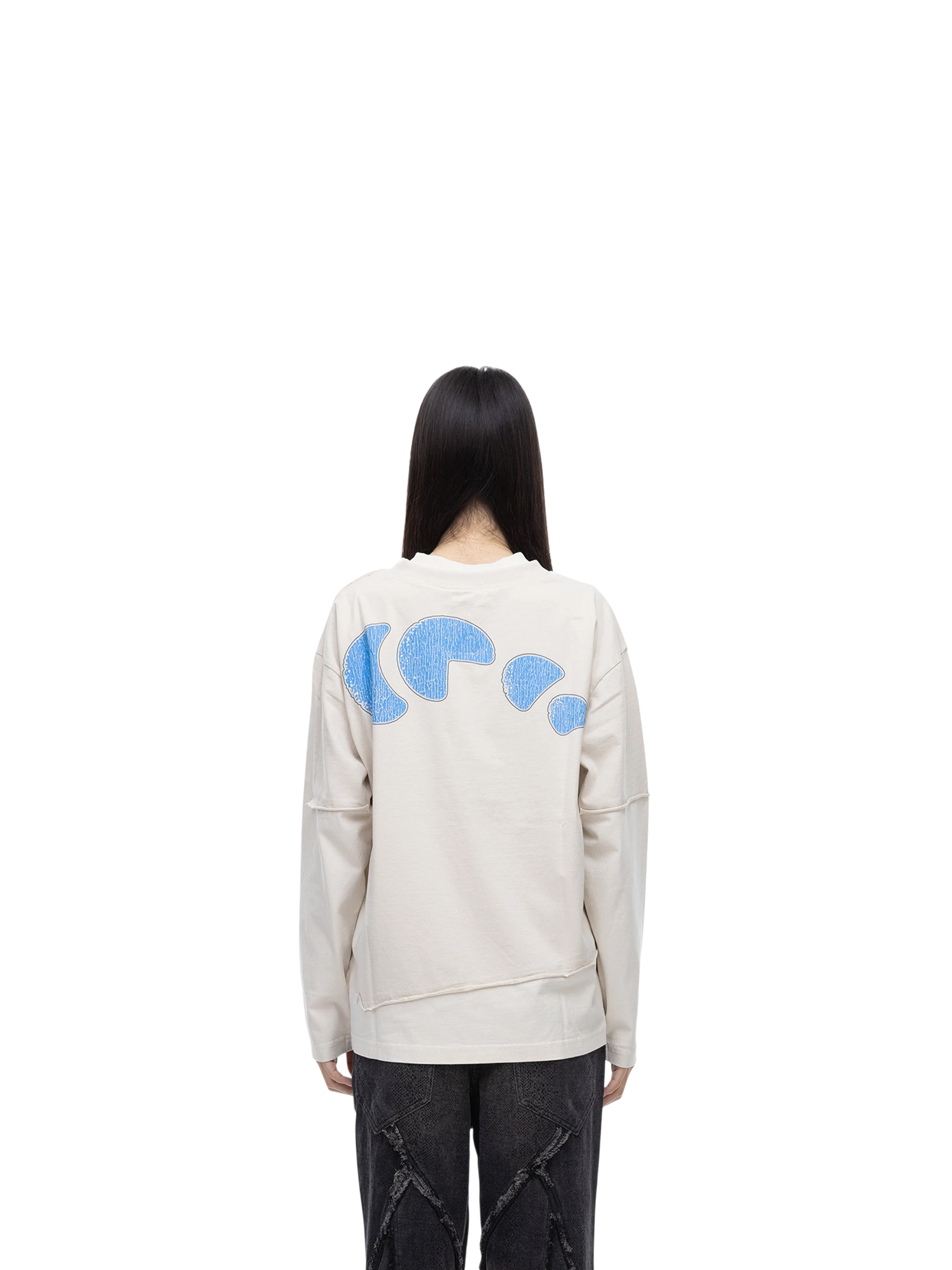 Female model wearing TBHNP grayish-yellow knight long-sleeve tee, back view — men's streetwear tee