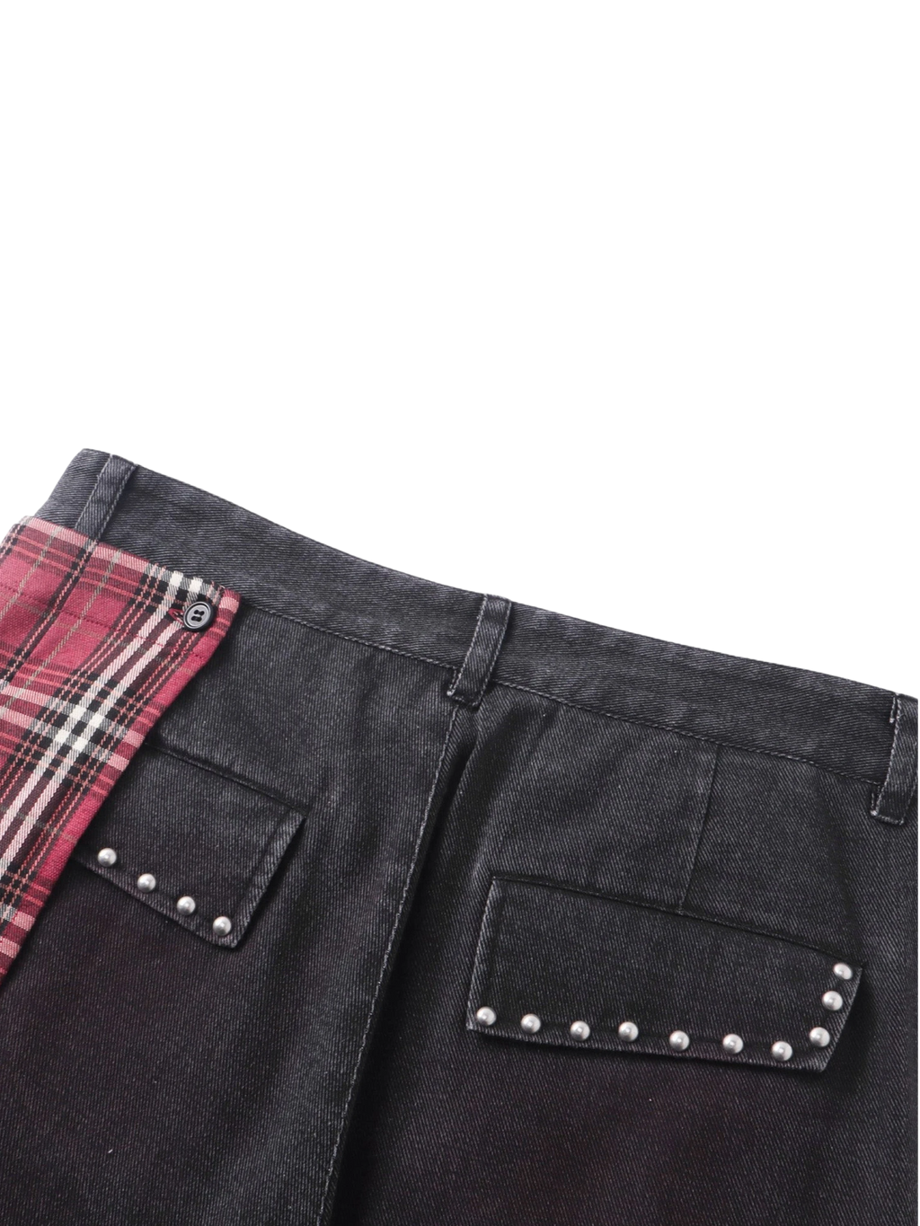 Close-up of the back pocket studs and plaid trim on TBHNP skirt trousers — men's streetwear detail