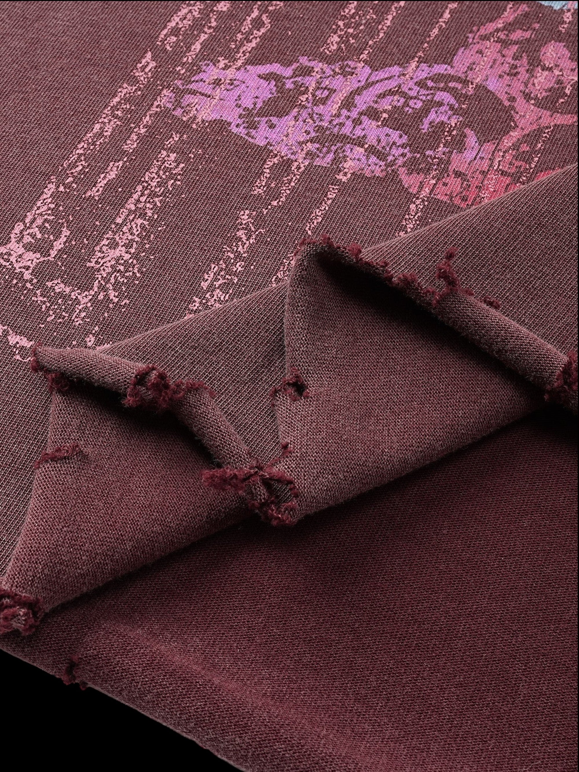 Close-up of the washed burgundy fabric on TBHNP Wraith Sorcerer tee — men's streetwear detail