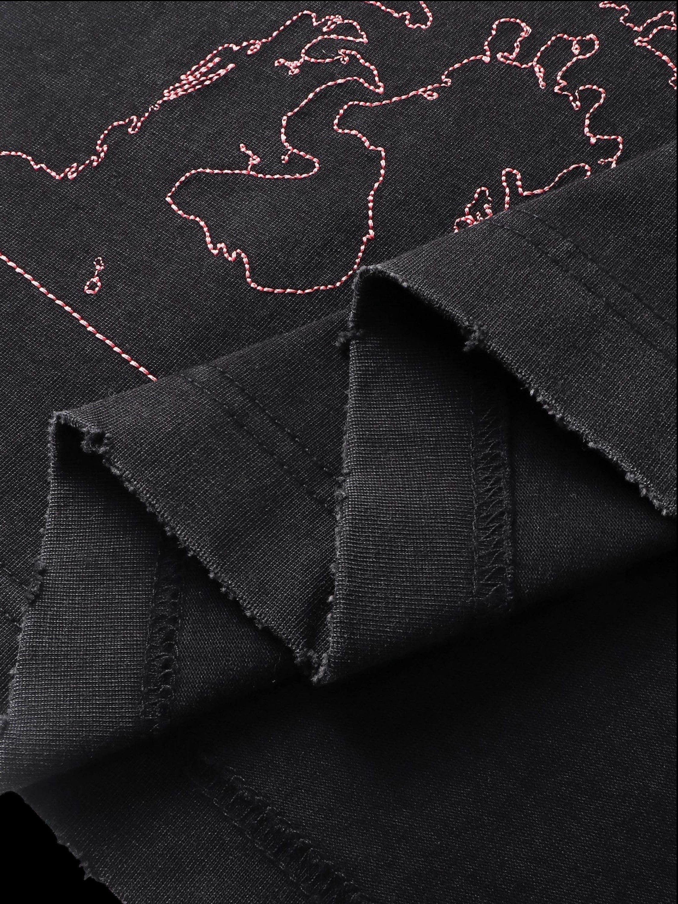 Close-up of the back graphic print on TBHNP black arrival short-sleeve tee — men's streetwear detail