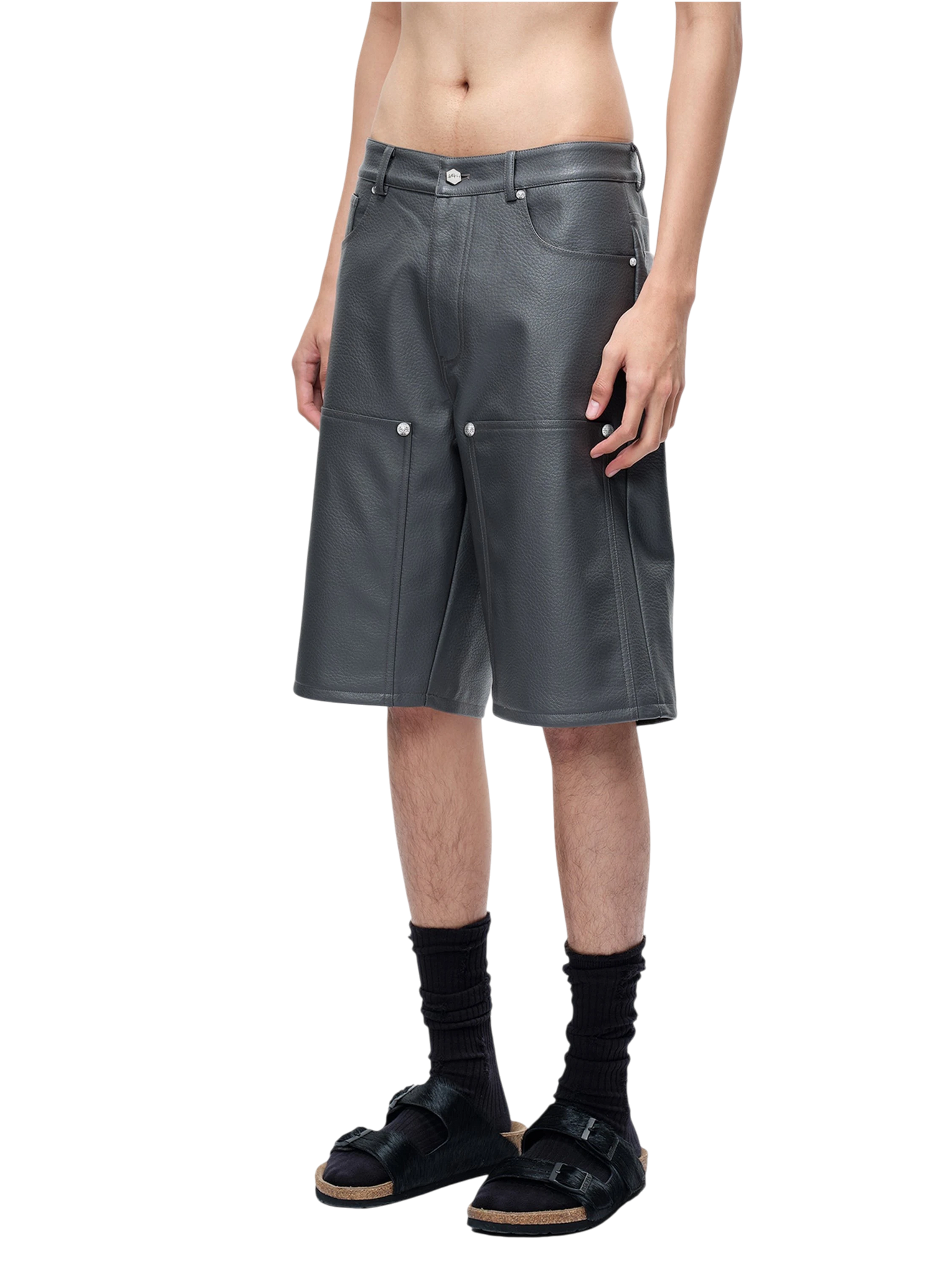 Model wearing TBHNP grey faux-leather wide-leg shorts, front — men's streetwear shorts