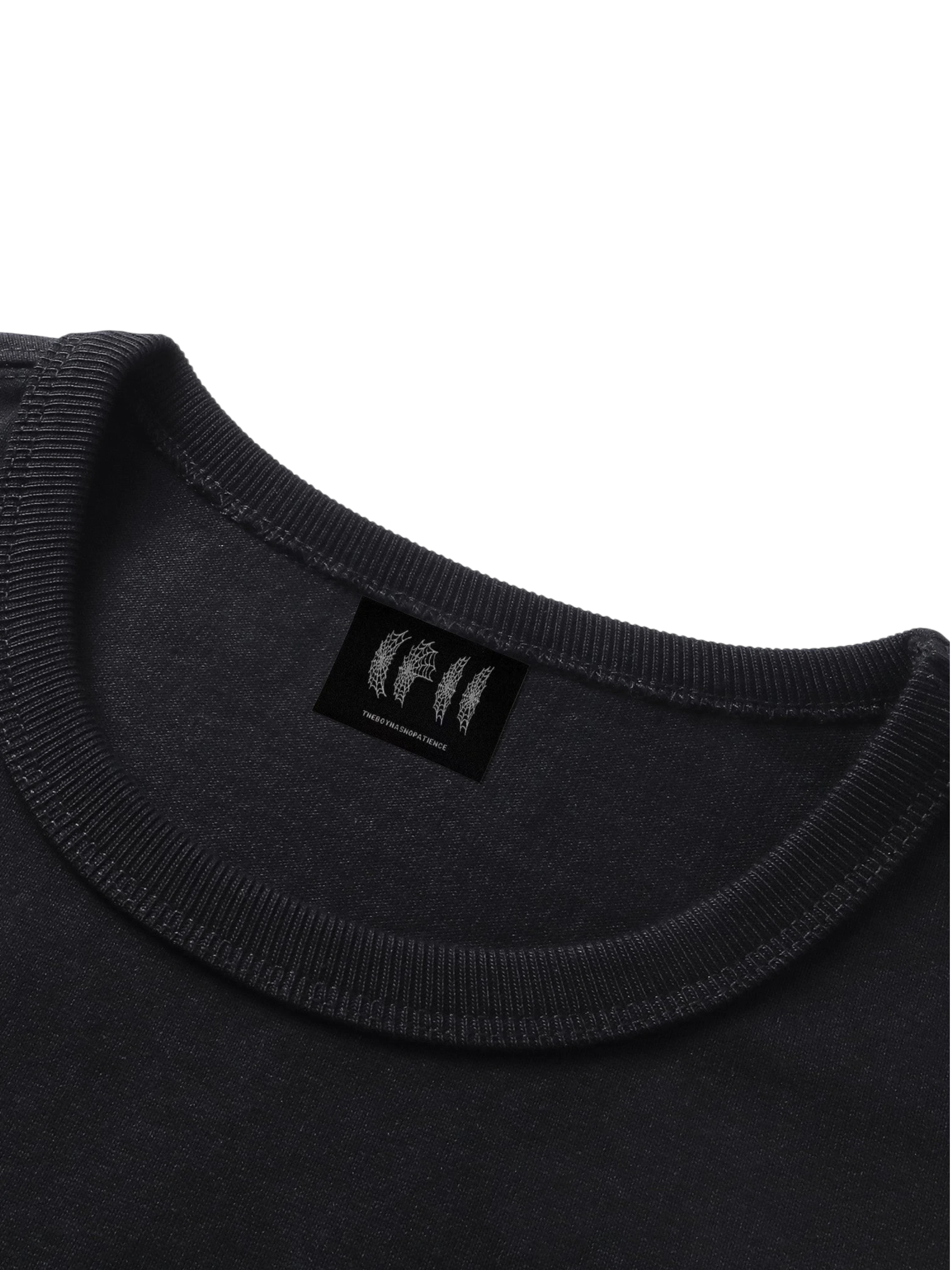 Close-up of the crew neck on TBHNP black Shadowbat vest — men's streetwear detail