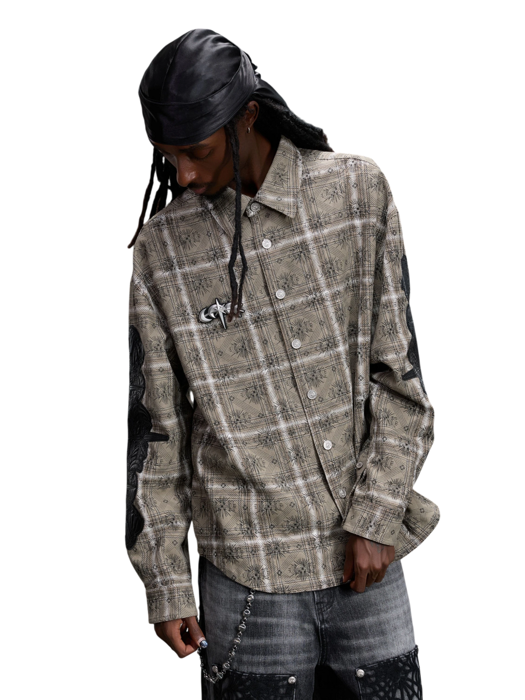 Model wearing the plaid shirt open as a layered overshirt.