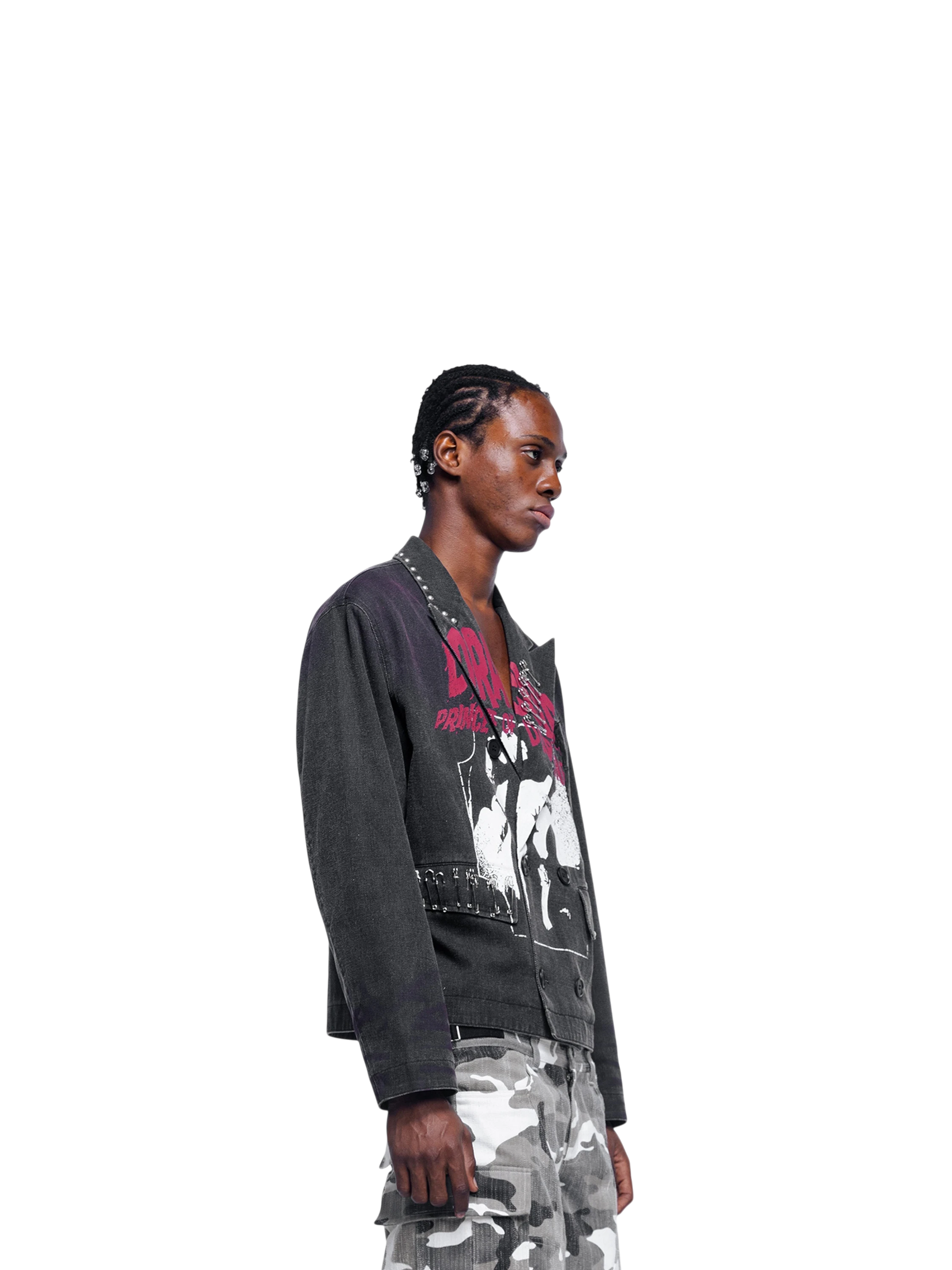 Male model in TBHNP Prince of Darkness spray-painted blazer, side view — men's streetwear