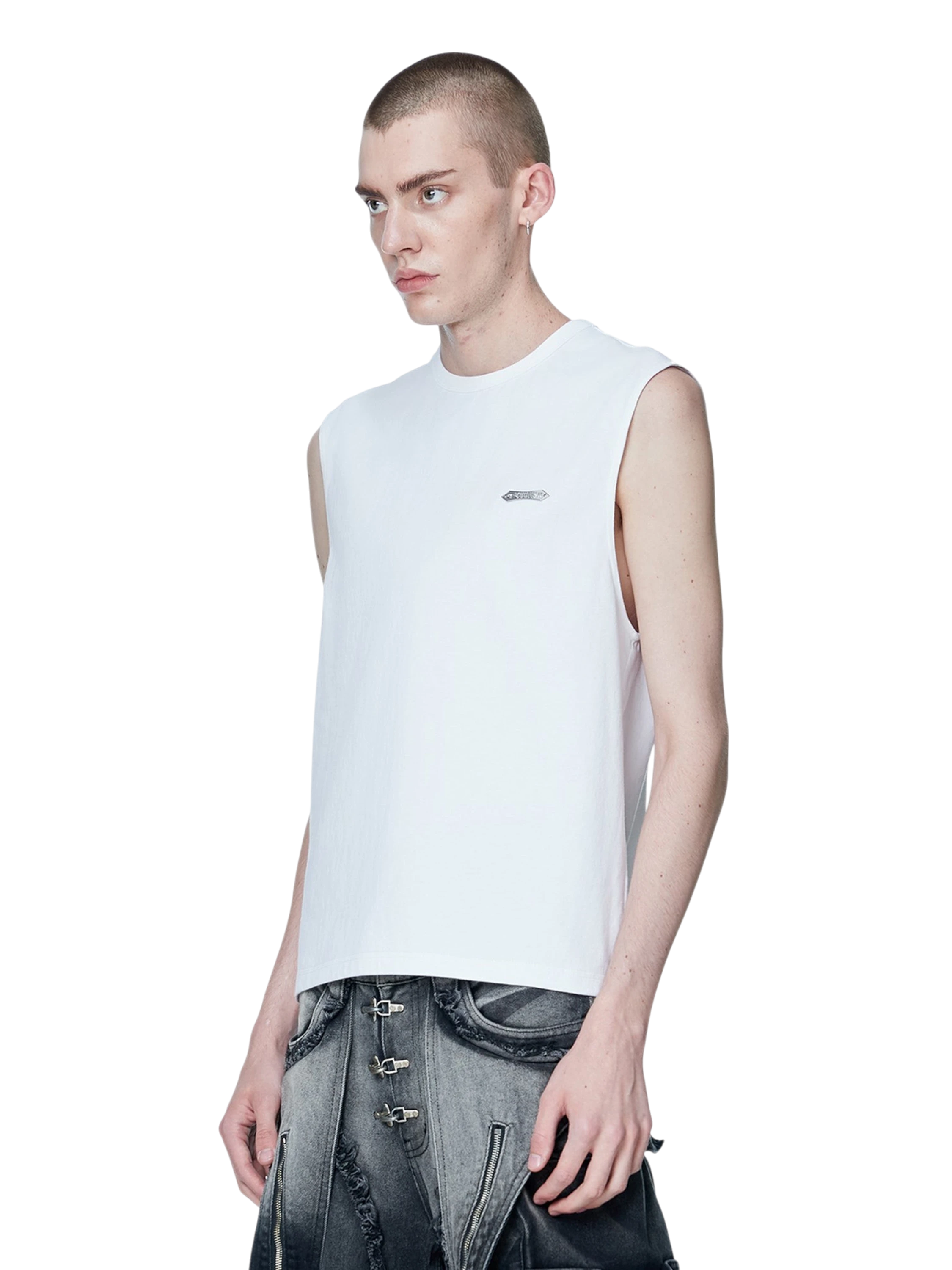 Model styling TBHNP white Shadowbat vest, front detail — men's streetwear sleeveless tee