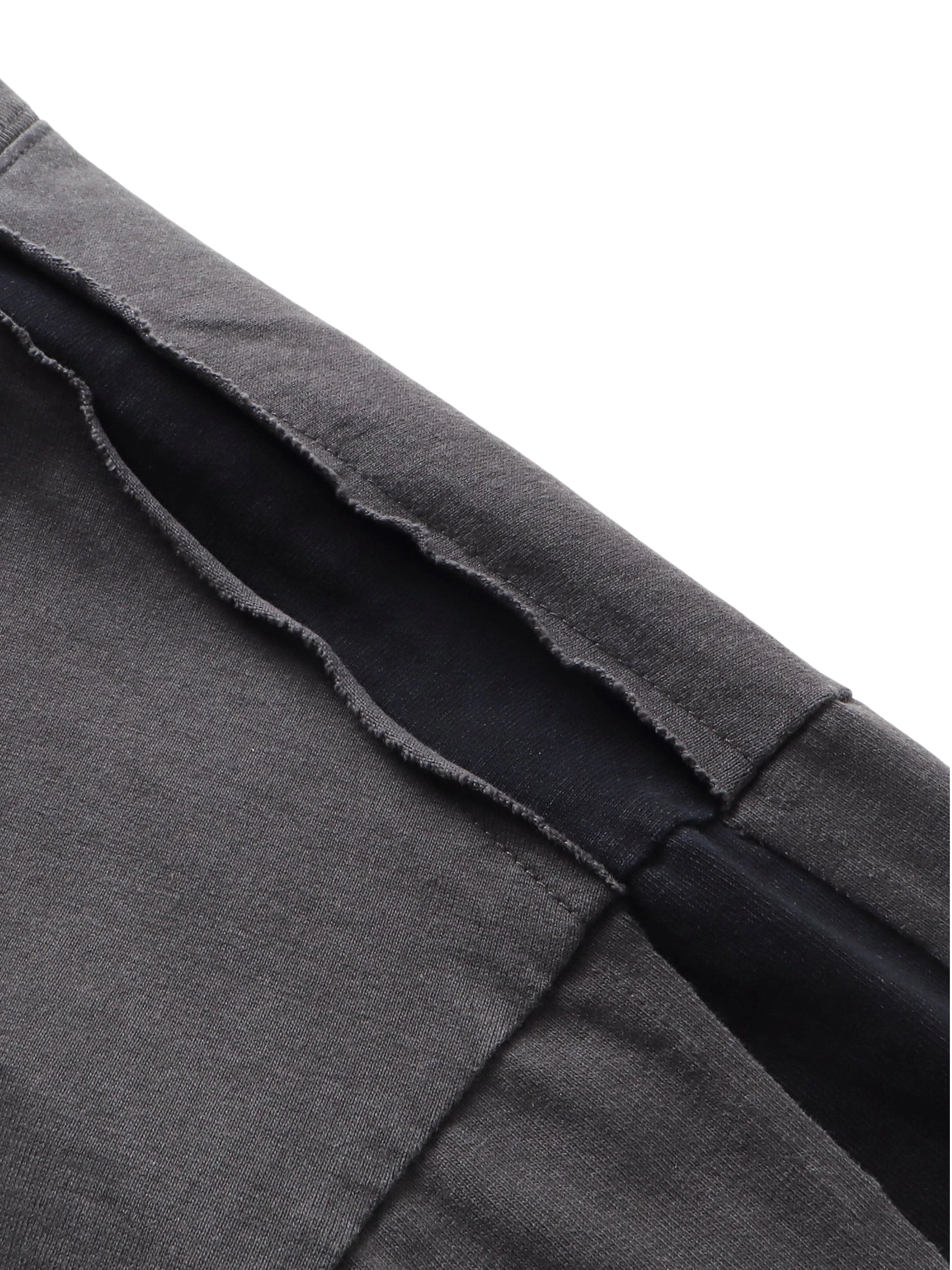 Close-up of the distressed double-wash finish on TBHNP black knight tee — men's streetwear detail