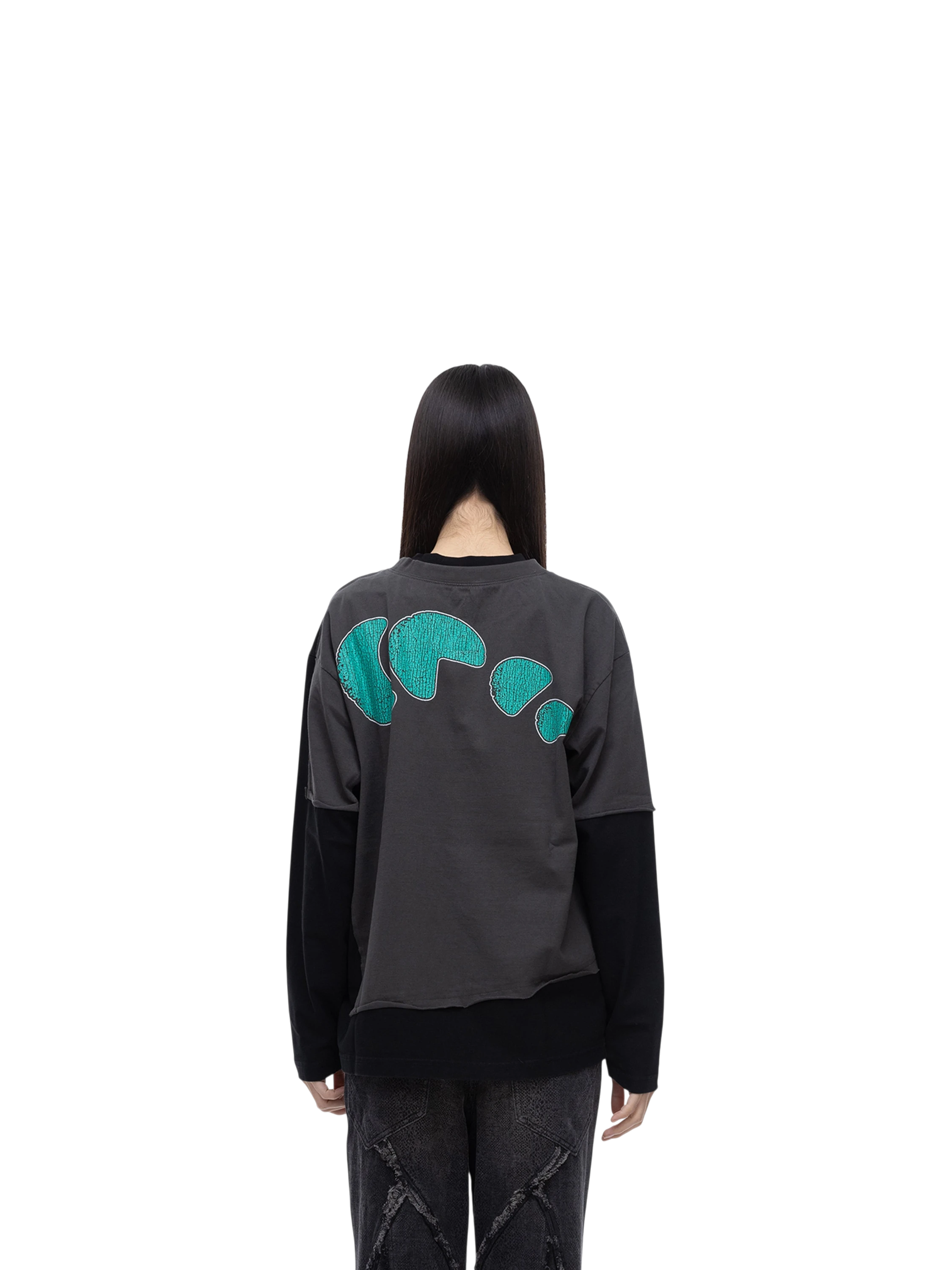 Model wearing TBHNP black arrival knight long-sleeve tee, back view — men's streetwear tee