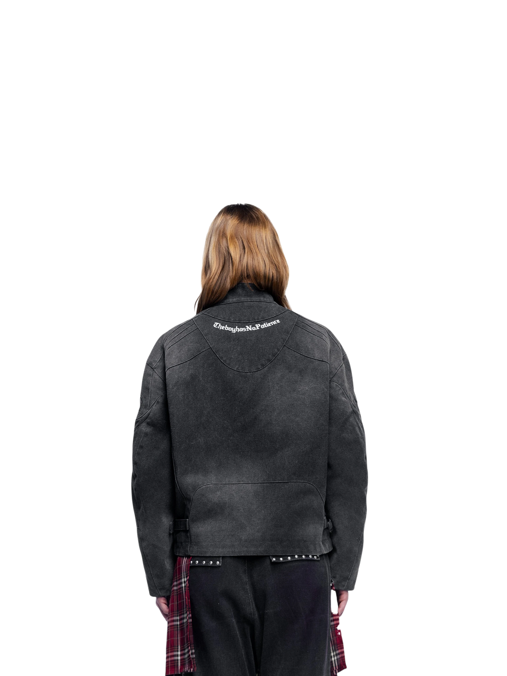 Female model wearing TBHNP black canvas moto jacket, back view — men's streetwear jacket