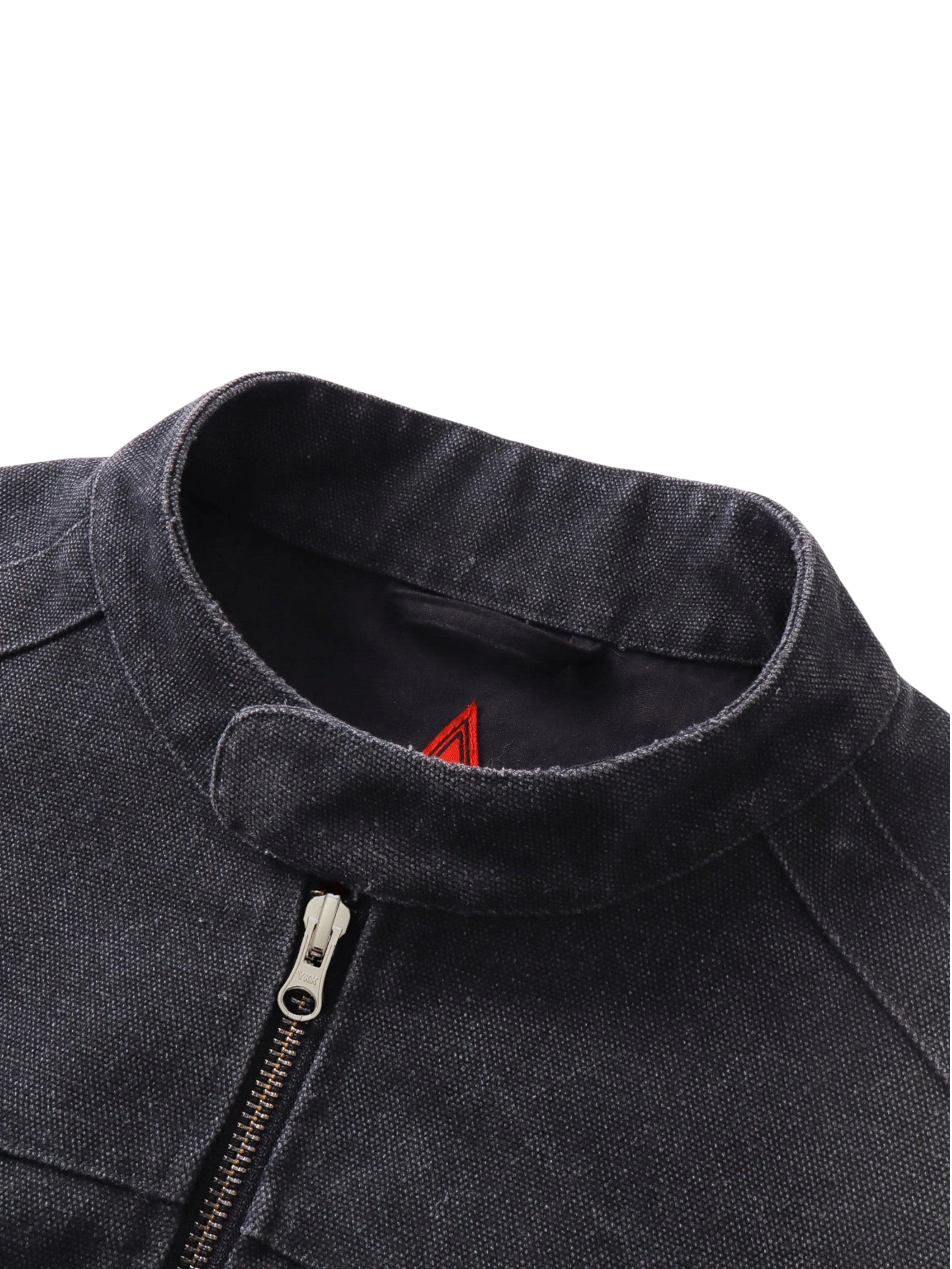 Close-up of the stand collar and zip cuff on TBHNP black canvas moto jacket — men's streetwear detail