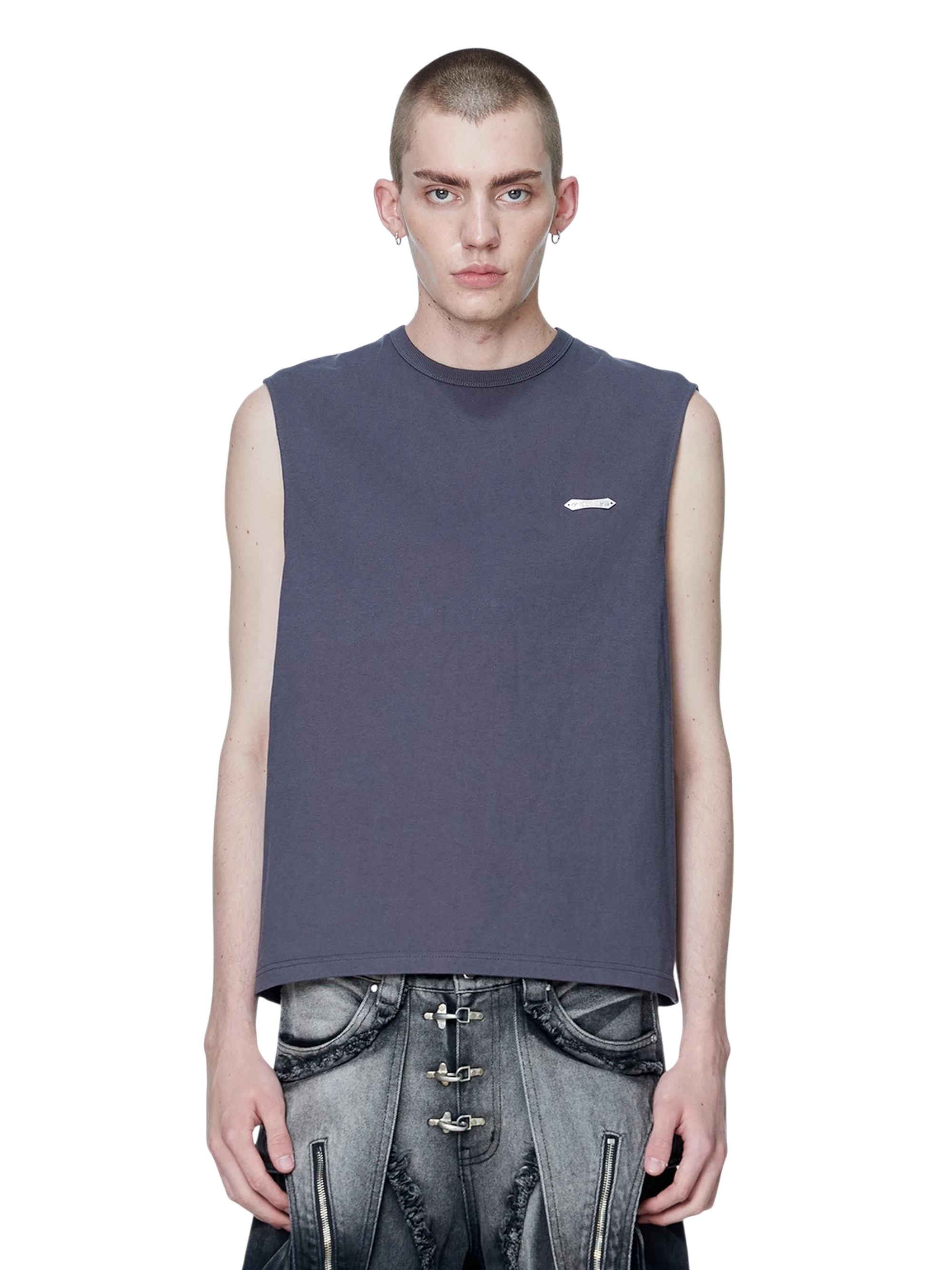 Model wearing TBHNP dark grey Astral Logo Shadowbat vest, front — men's streetwear sleeveless tee