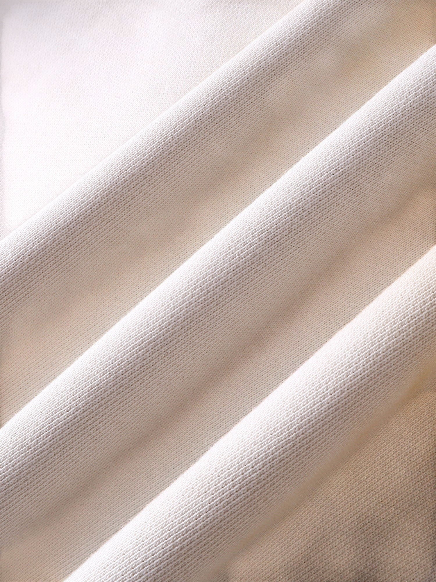 Close-up of the heavyweight cotton fabric on TBHNP arrival knight hoodie — men's streetwear detail