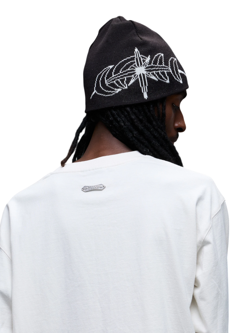 Model wearing Black Luminous Dawn jacquard beanie, back and side view