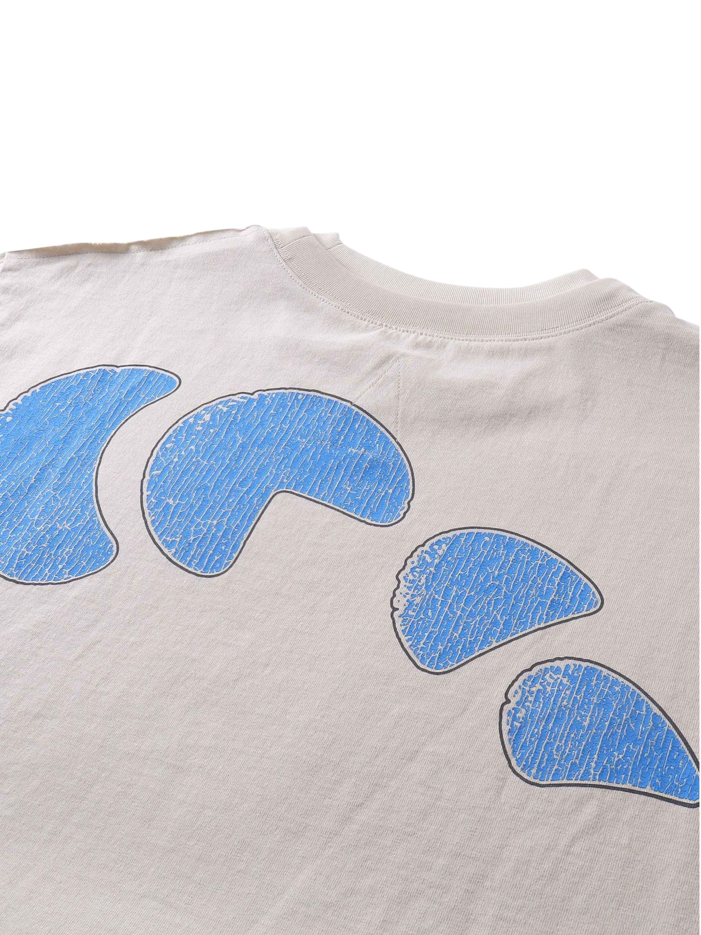 Close-up of the knight engraving print on TBHNP grayish-yellow tee — men's streetwear detail