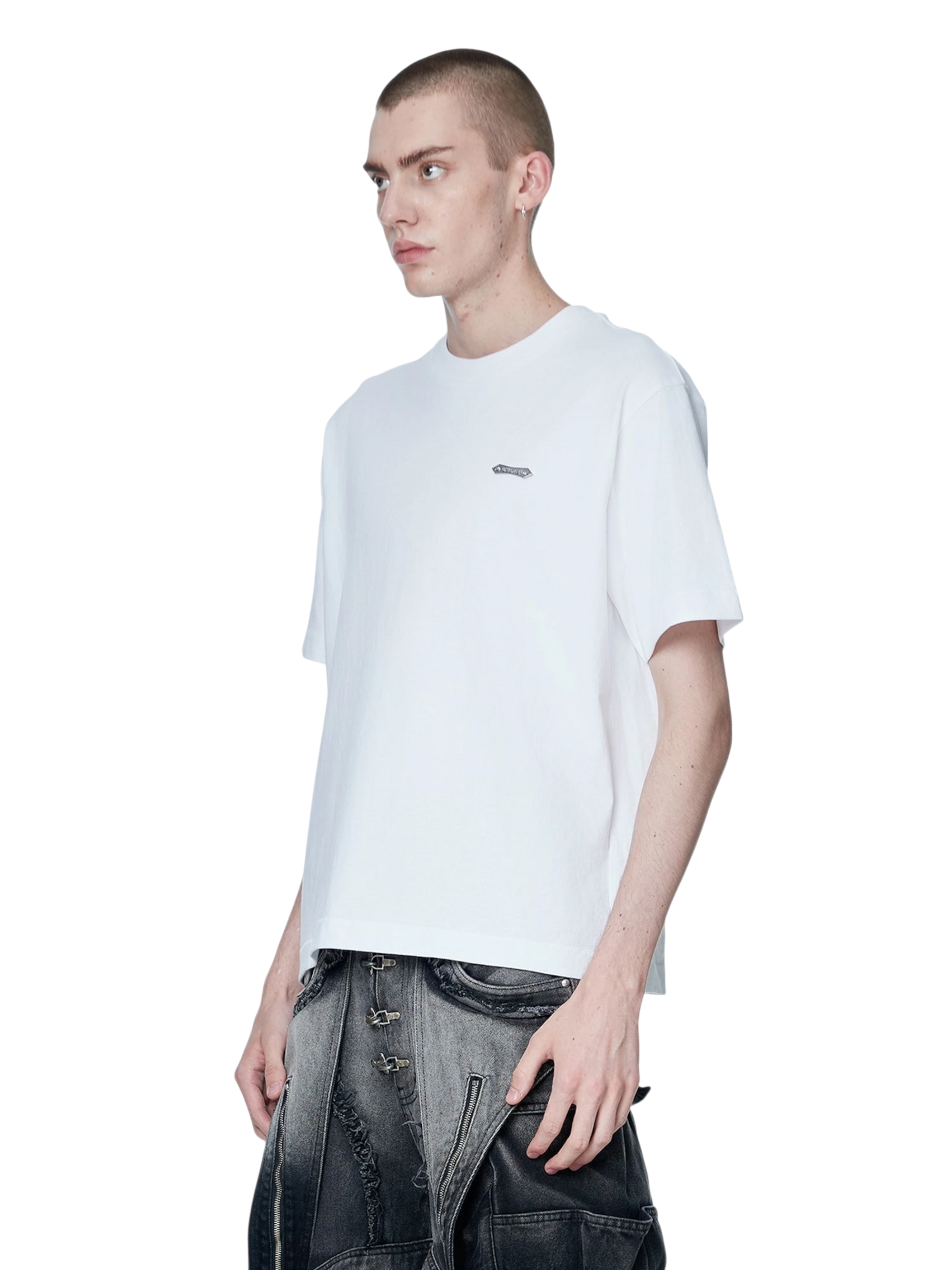 Model styling TBHNP white Emblem & Shadowbat tee, front detail — men's streetwear tee