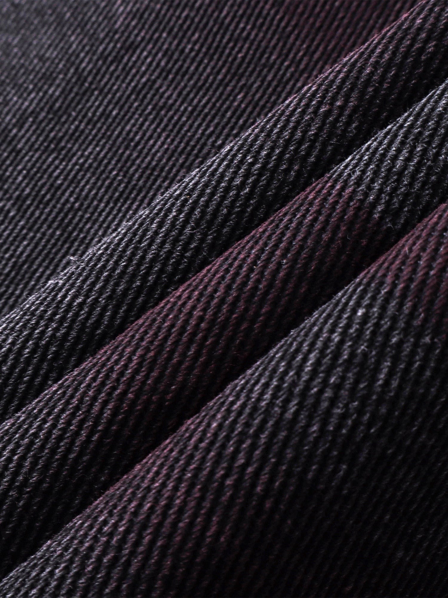 Close-up of the spray-wash whiskering on TBHNP Prince of Darkness trousers — men's streetwear detail