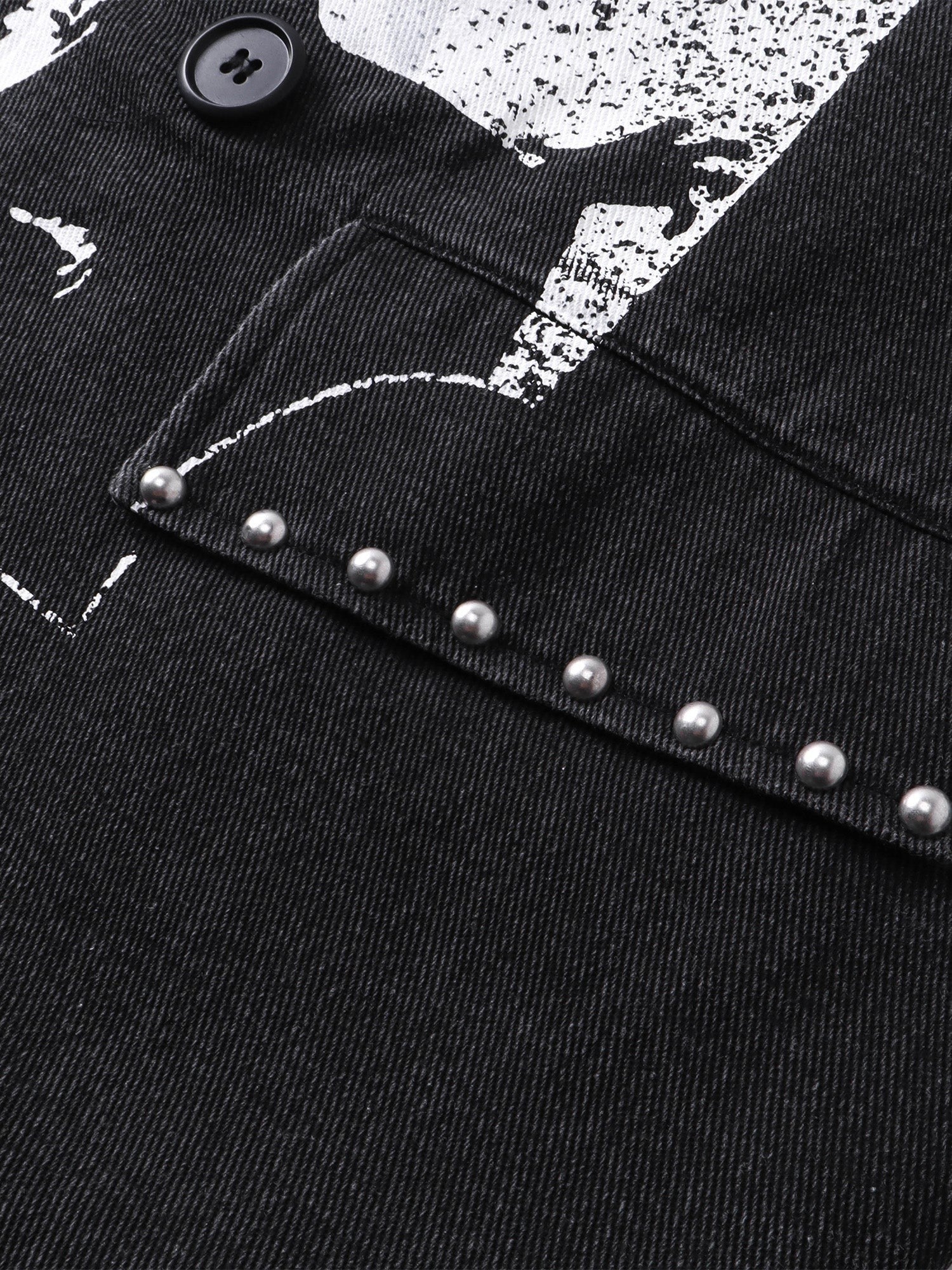 Close-up of the metal studs and safety-pin detailing on TBHNP black blazer — men's streetwear detail