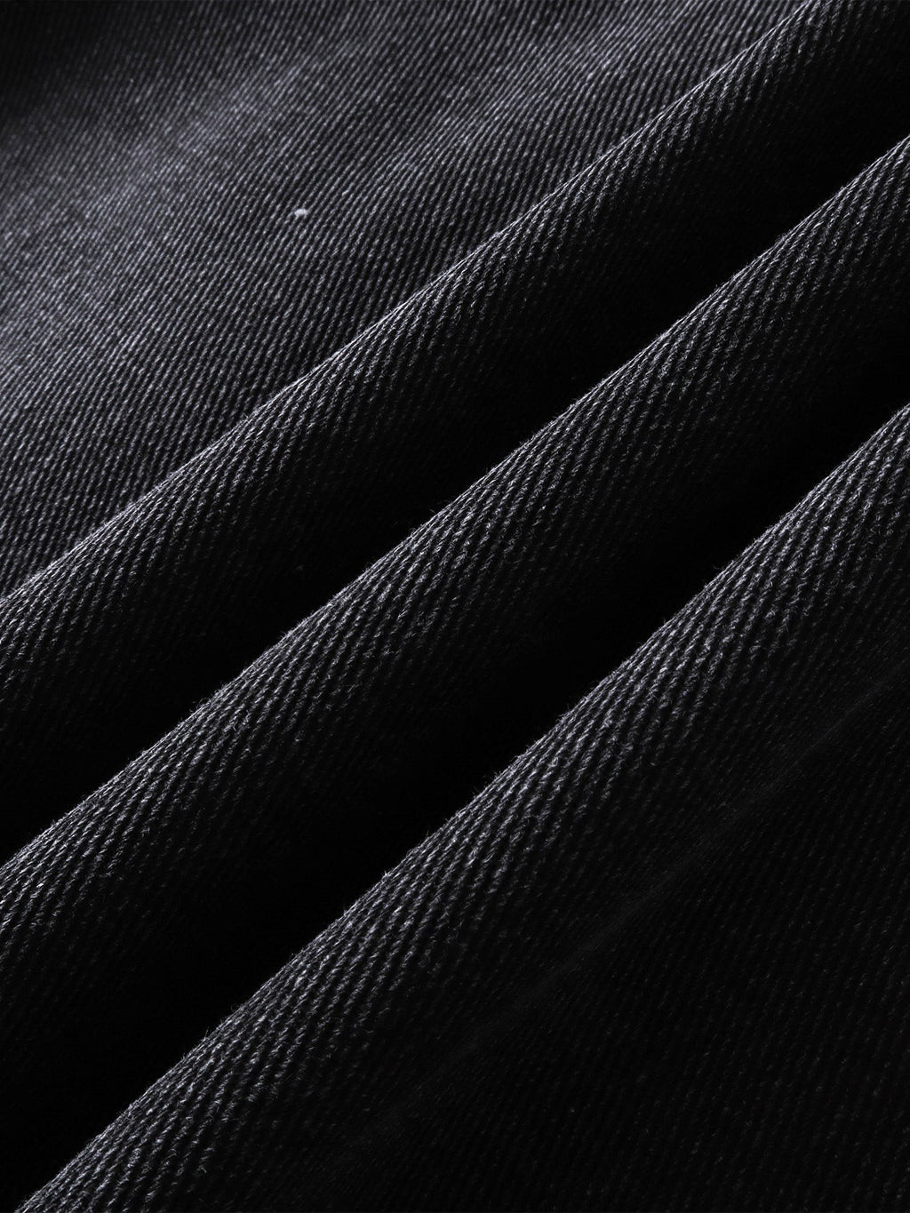 Close-up of the heavyweight cotton fabric on TBHNP Prince of Darkness blazer — men's streetwear detail