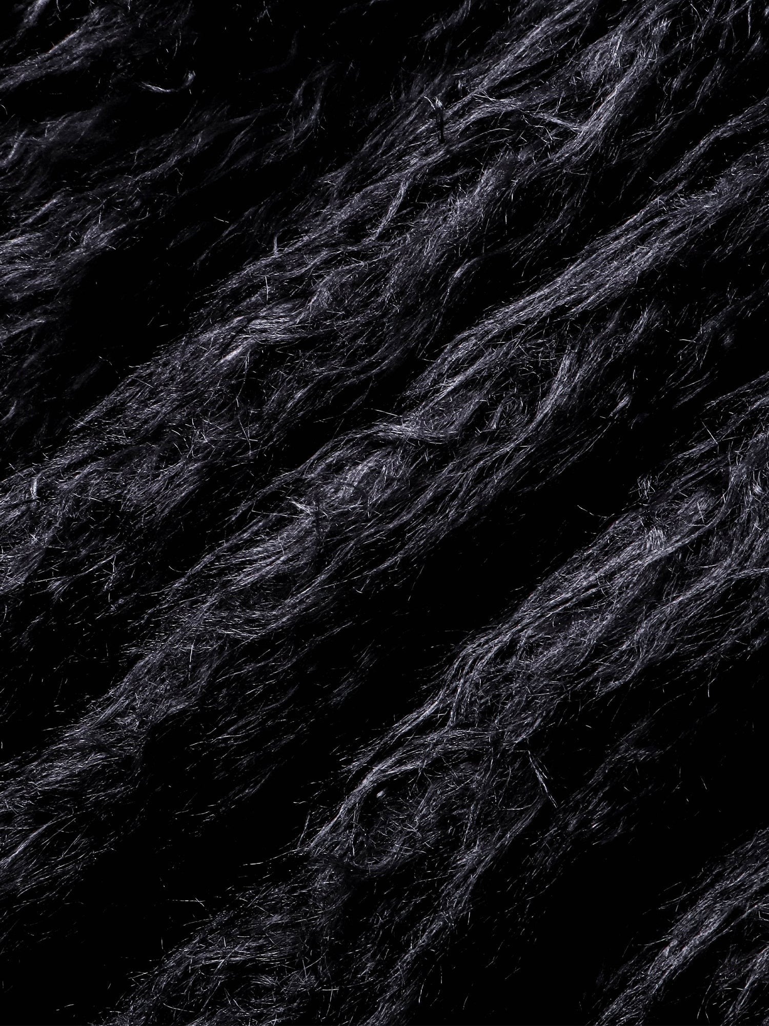 Close-up of the plush faux-fur texture on TBHNP Eclipse bomber jacket — men's streetwear detail