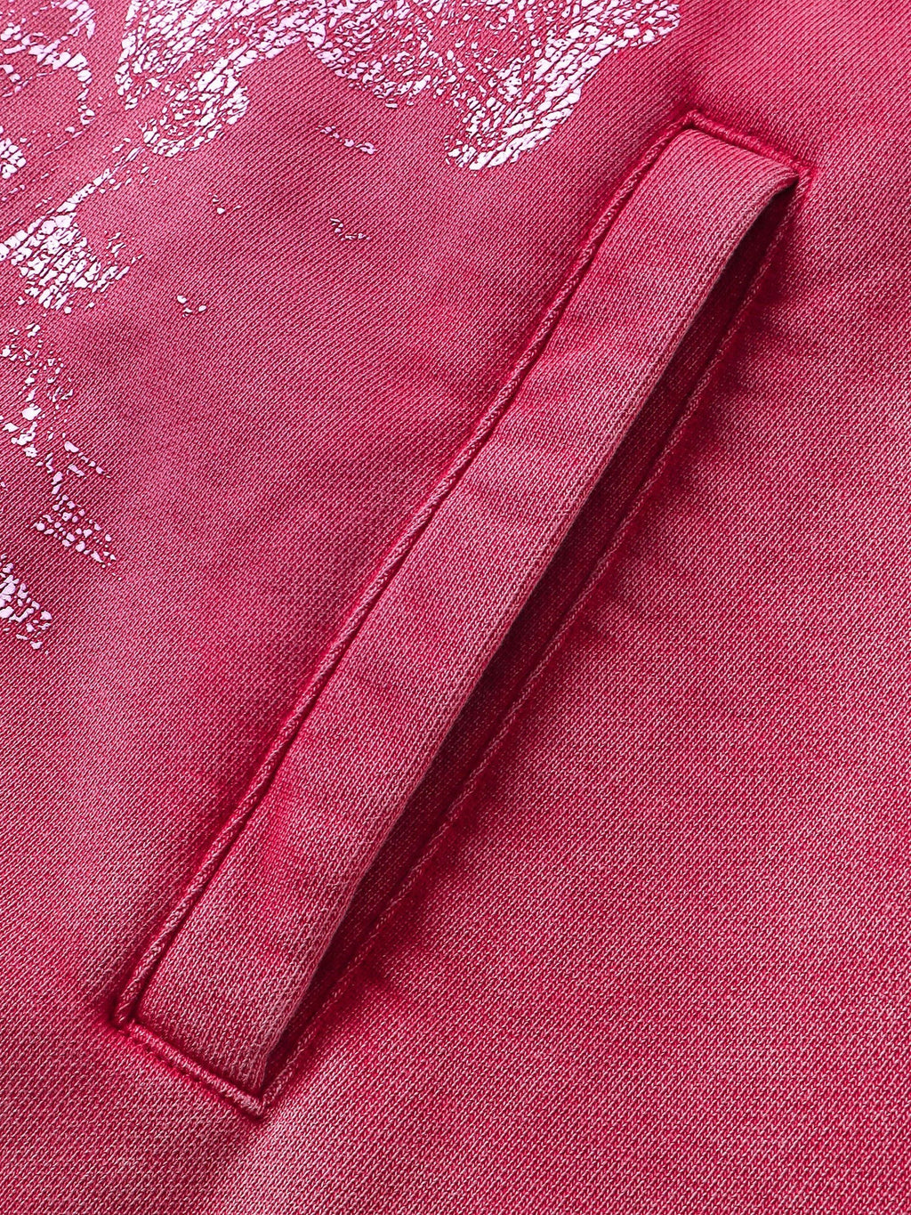 Close-up of the sleeve print on TBHNP red knight hoodie — men's streetwear detail