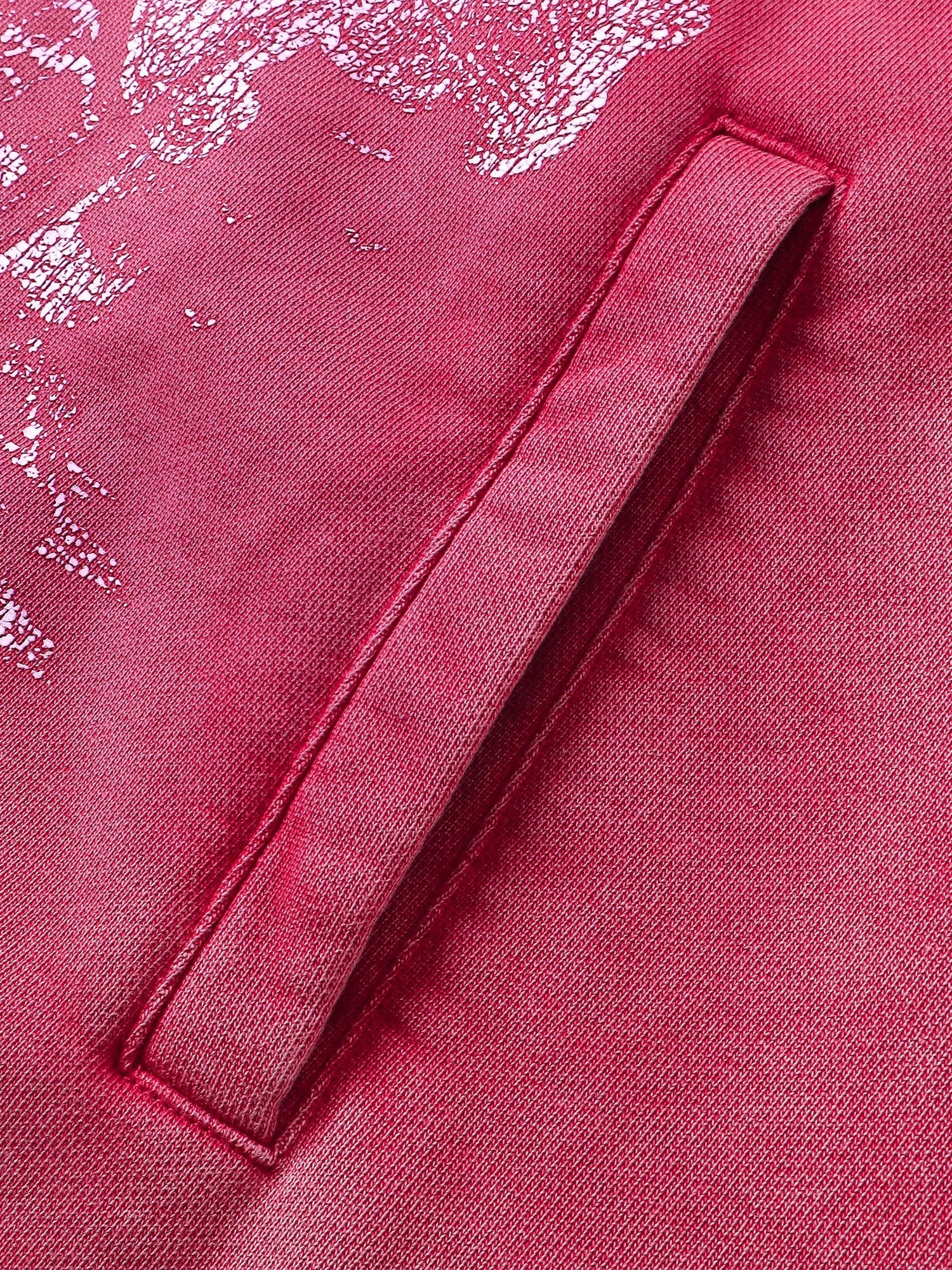 Close-up of the sleeve print on TBHNP red knight hoodie — men's streetwear detail