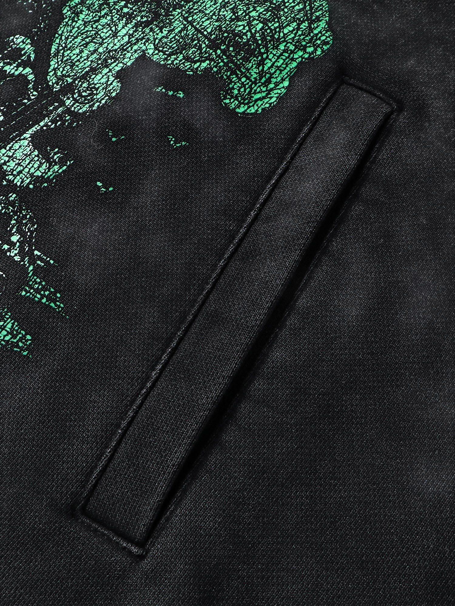 Close-up of the distressed sleeve print on TBHNP black knight hoodie — men's streetwear detail
