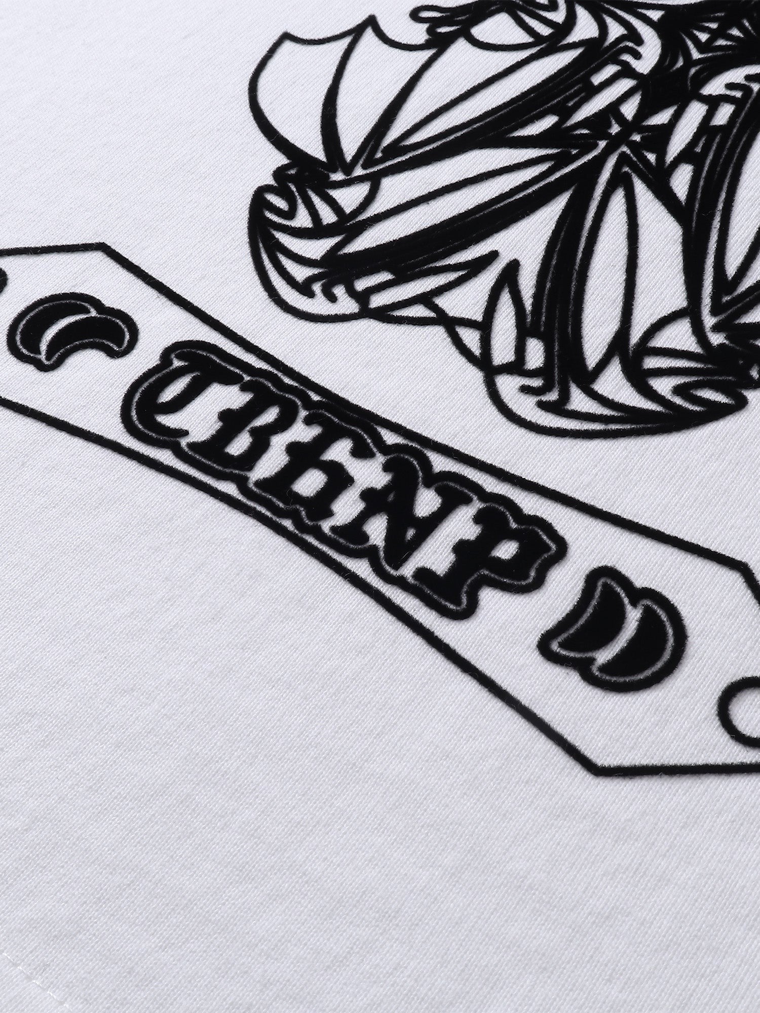 Close-up of the flocked emblem print detail on TBHNP Shadowbat vest — men's streetwear detail