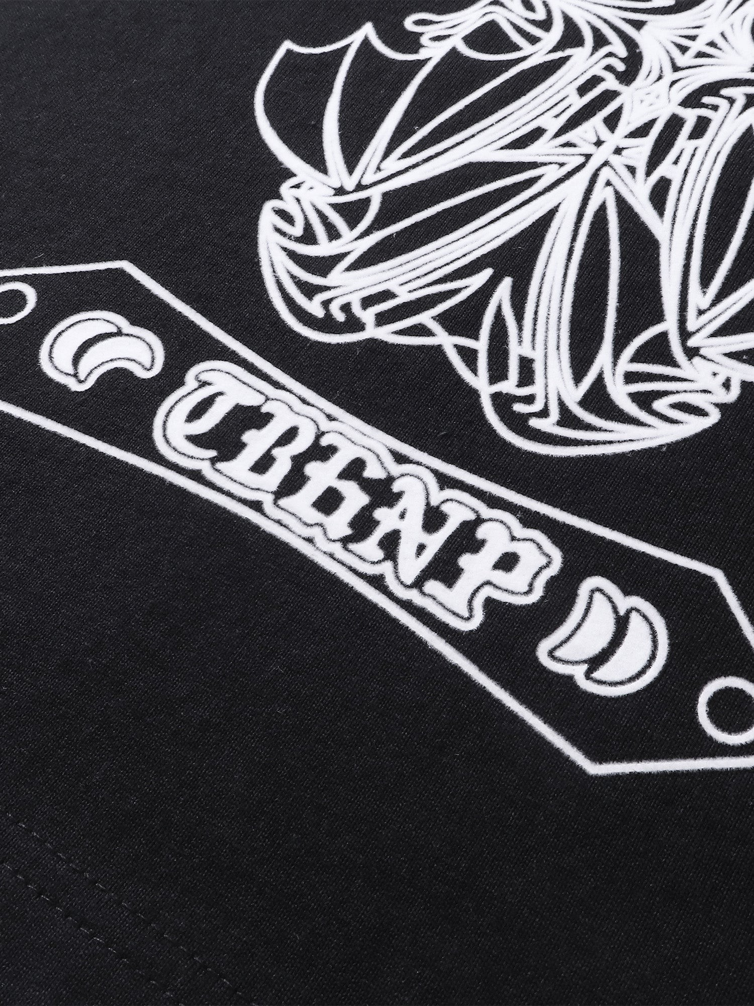 Close-up of the shadowbat starburst print detail on TBHNP black vest — men's streetwear detail