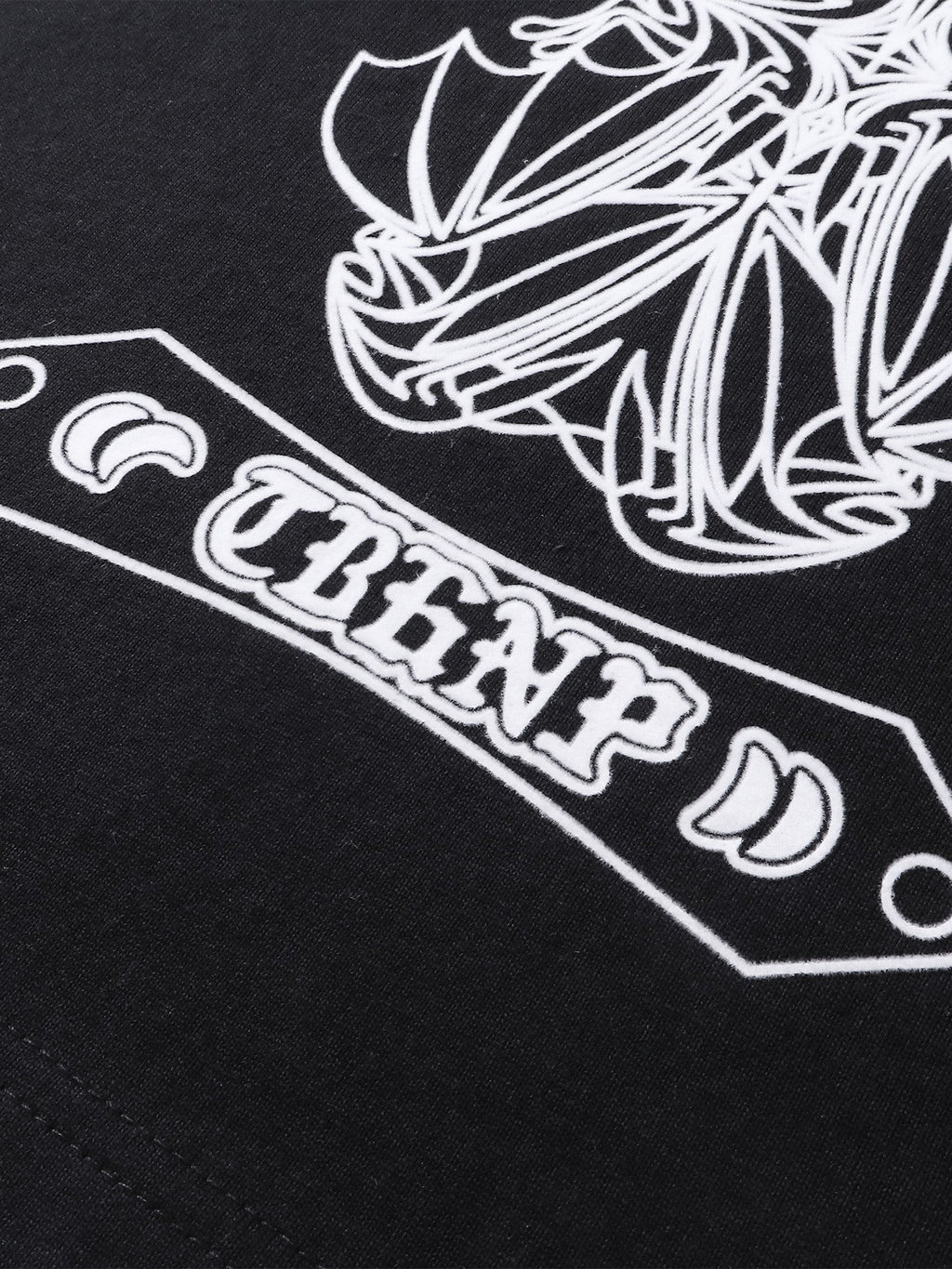 Close-up of the shadowbat starburst print detail on TBHNP black vest — men's streetwear detail