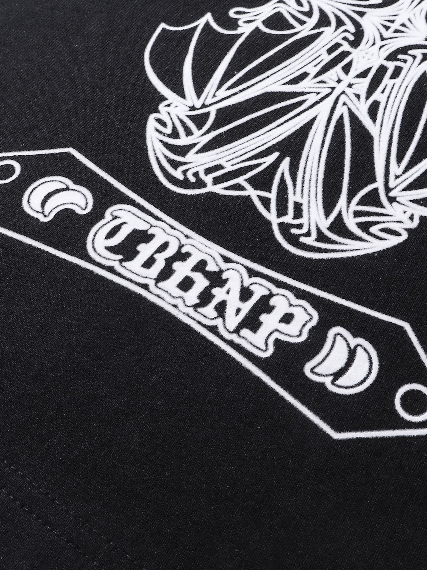 Close-up of the shadowbat starburst print detail on TBHNP black vest — men's streetwear detail