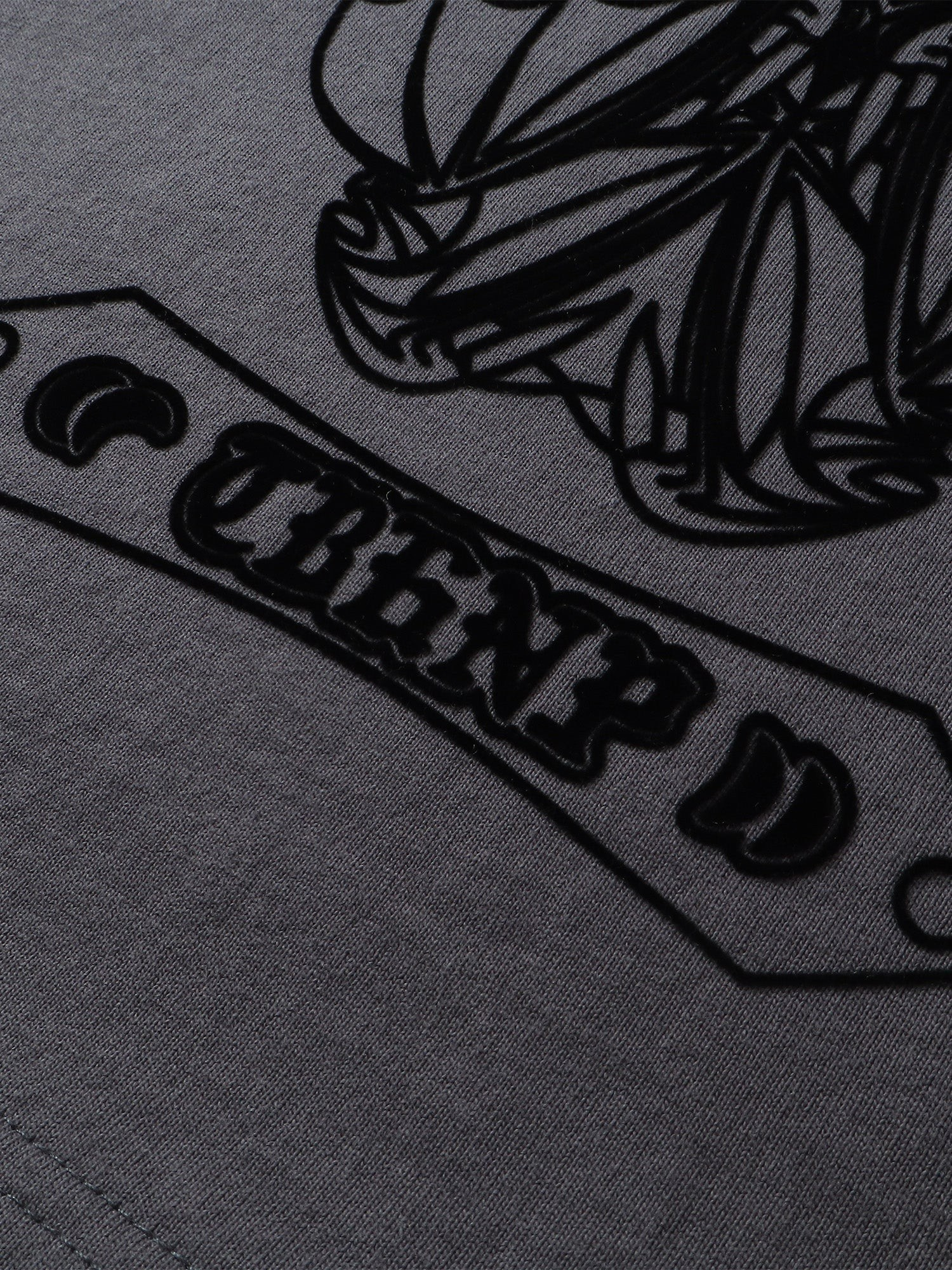 Close-up of the shadowbat print detail on TBHNP dark grey Shadowbat vest — men's streetwear detail