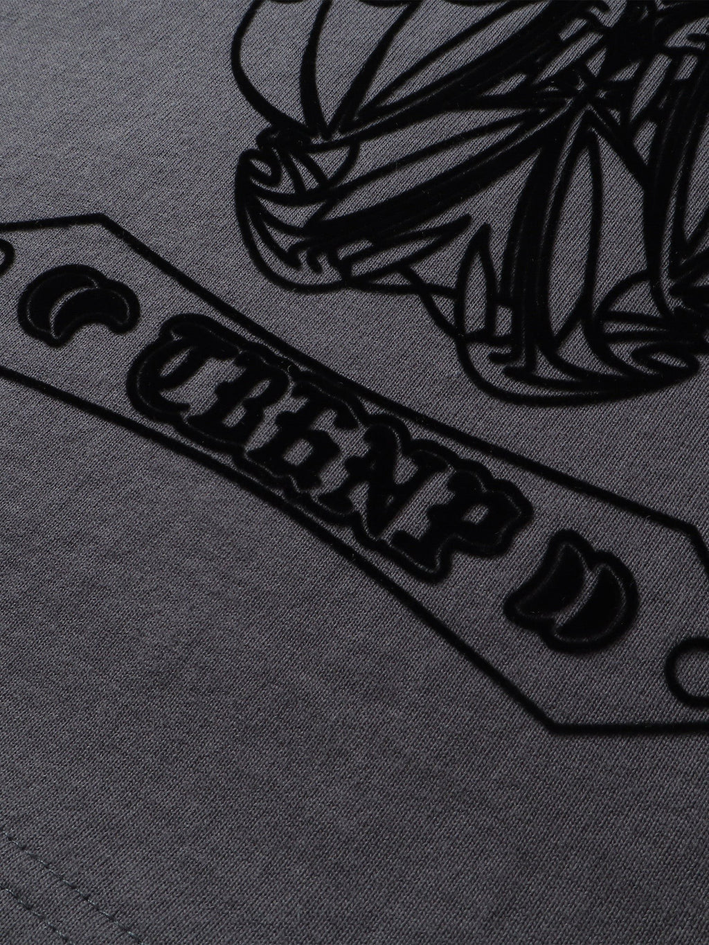 Close-up of the shadowbat print detail on TBHNP dark grey Shadowbat vest — men's streetwear detail