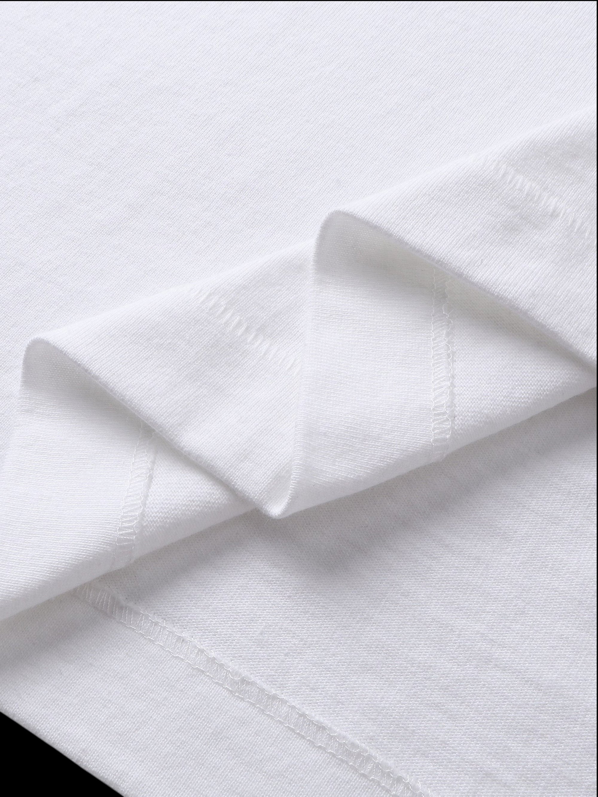 Close-up of the cotton texture on TBHNP white Emblem & Shadowbat tee — men's streetwear detail