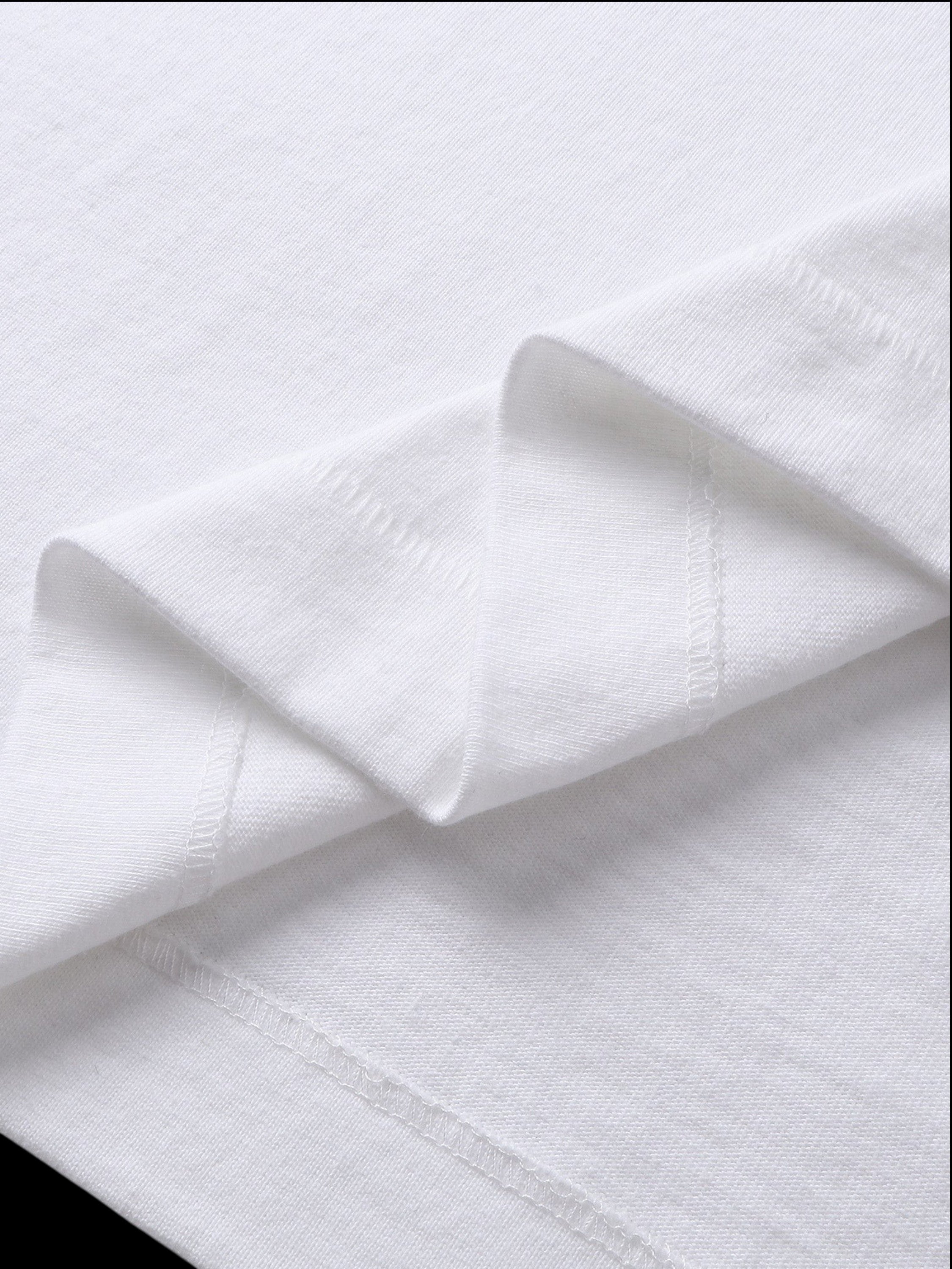 Close-up of the cotton texture on TBHNP white Emblem & Shadowbat tee — men's streetwear detail