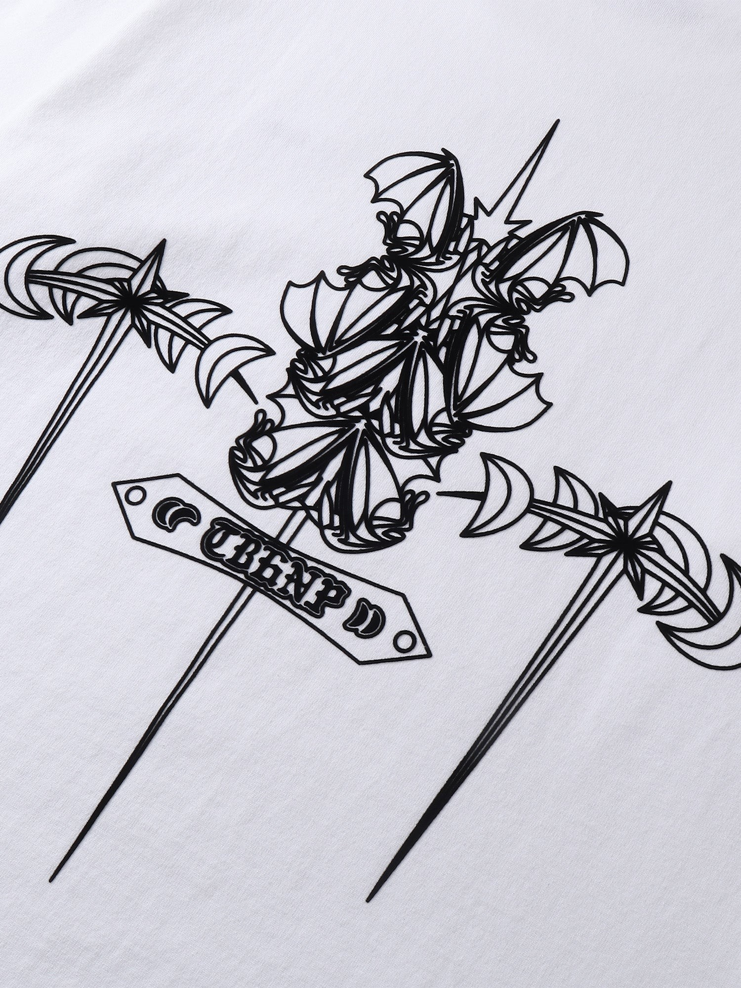 Close-up of the emblem print detail on TBHNP Emblem & Shadowbat tee — men's streetwear detail