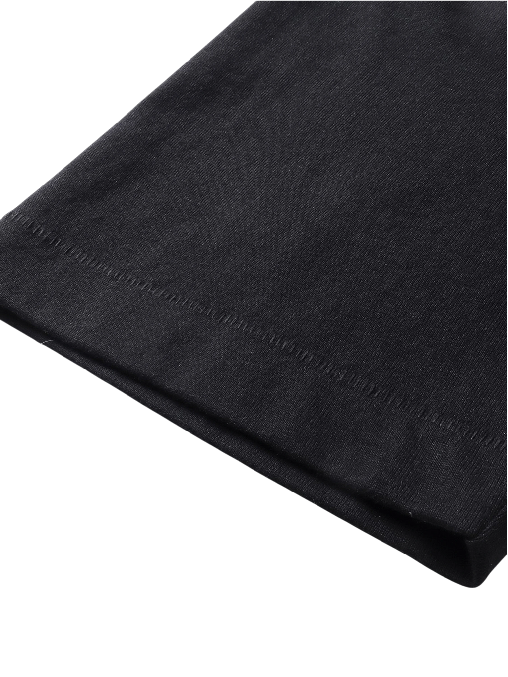 Close-up of the fabric fold on TBHNP black Emblem & Shadowbat tee — men's streetwear detail