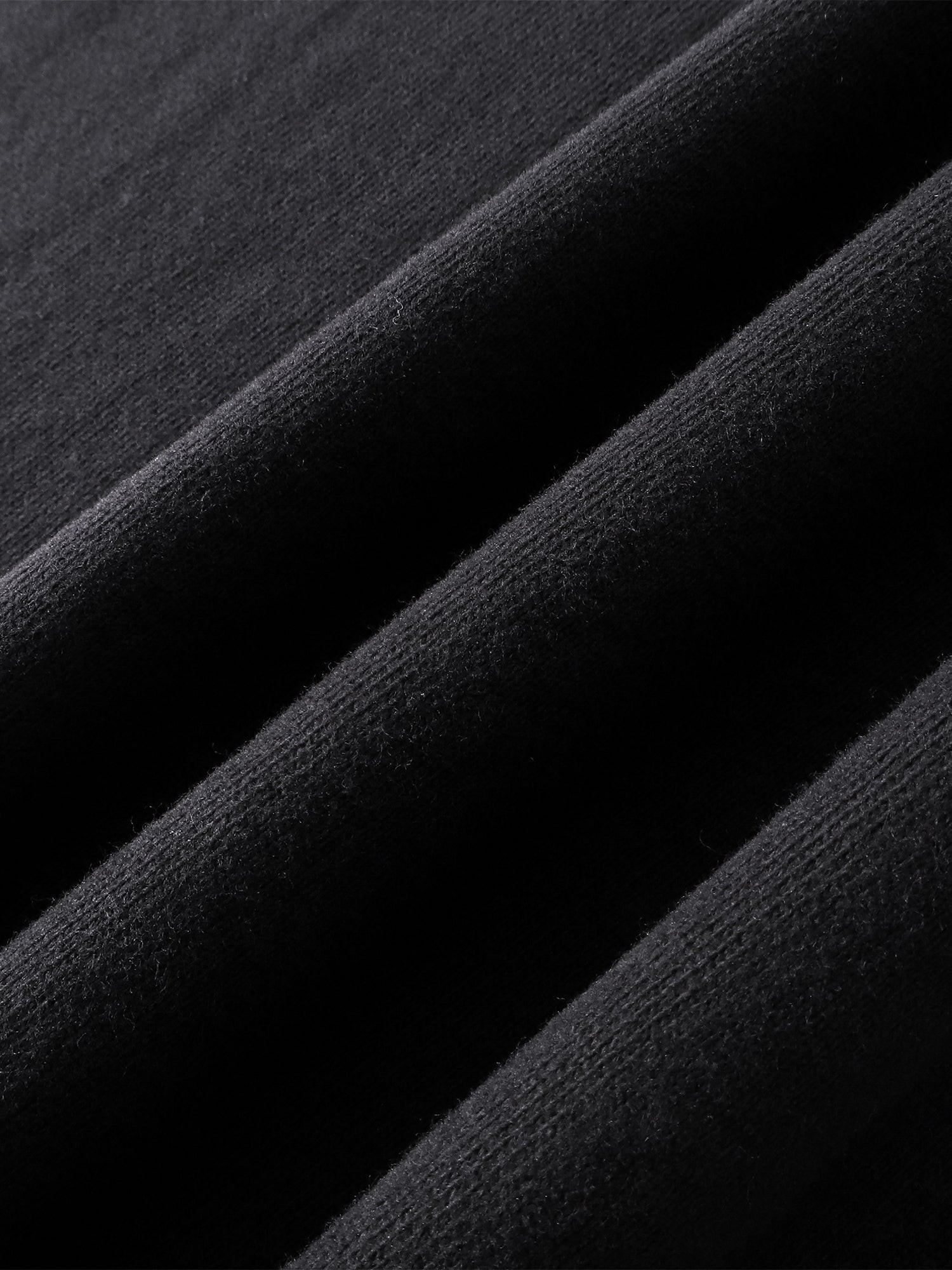 Close-up of the cotton texture on TBHNP dark grey Knight & Sword tee — men's streetwear detail