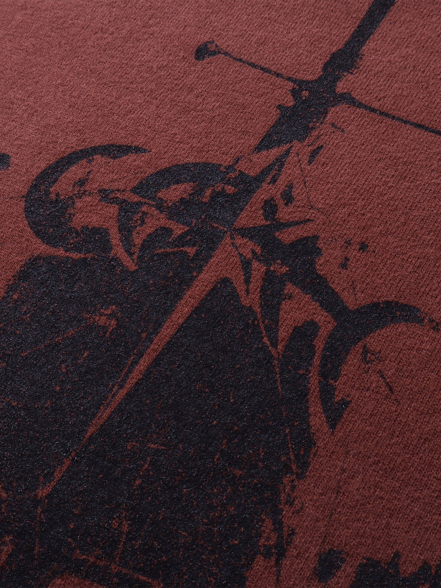 Close-up of the heavyweight cotton fabric on TBHNP red Knight & Sword tee — men's streetwear detail