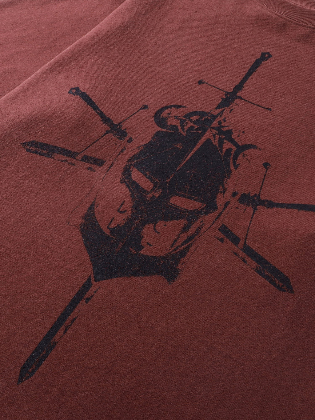 Close-up of the dropped-shoulder sleeve on TBHNP red Knight & Sword tee — men's streetwear detail