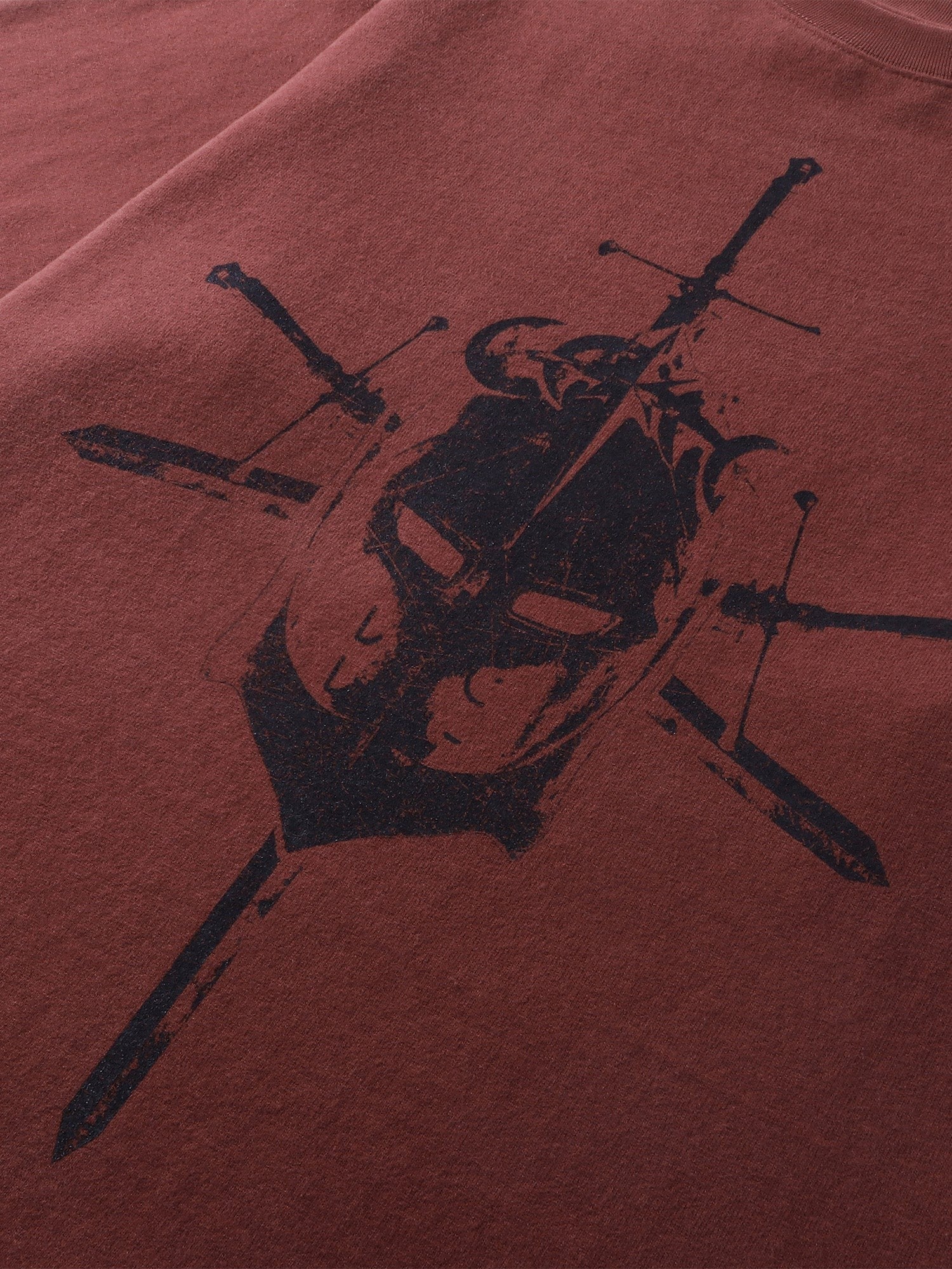 Close-up of the dropped-shoulder sleeve on TBHNP red Knight & Sword tee — men's streetwear detail