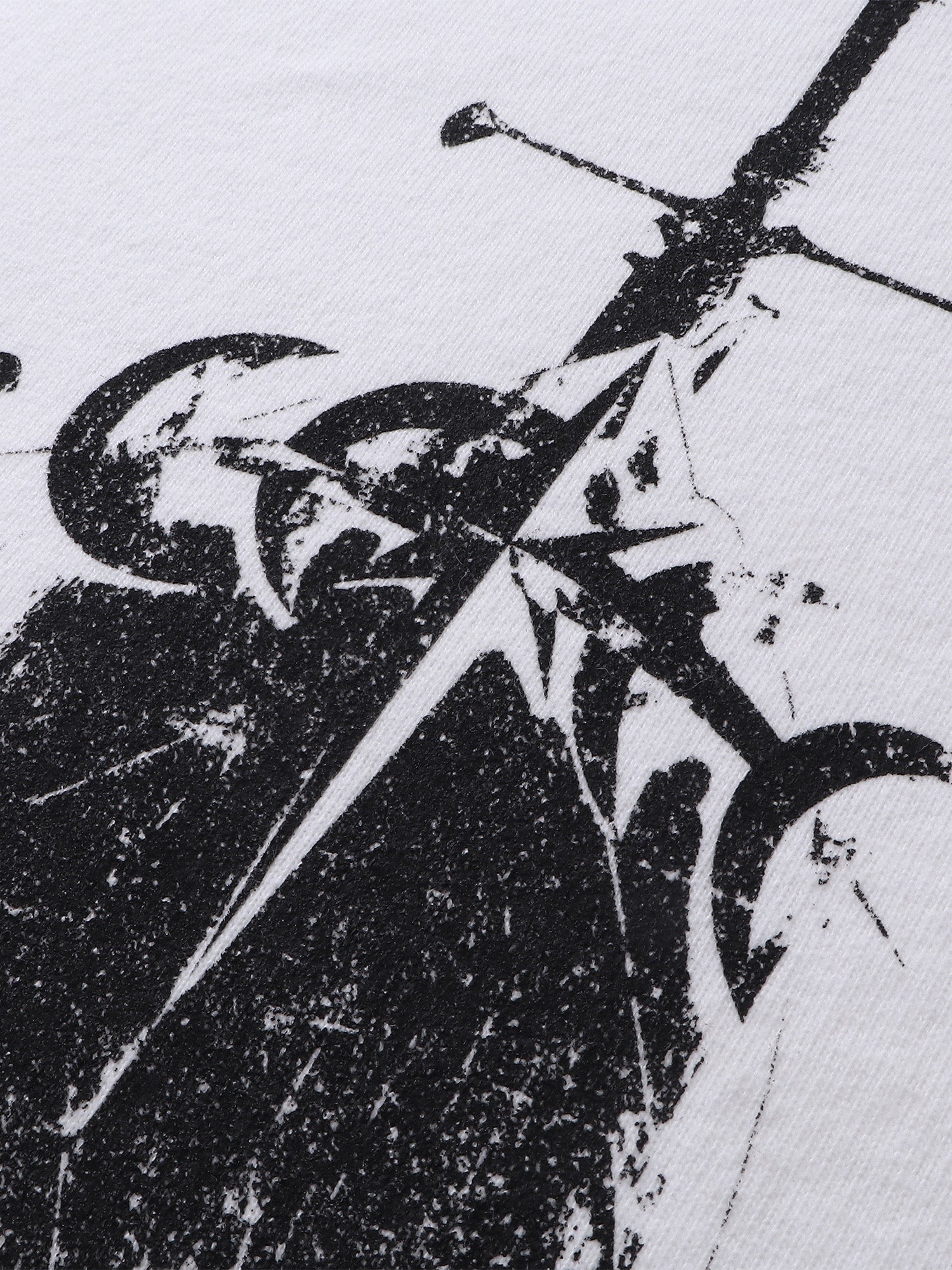 Close-up of the knight sword-and-shield print on TBHNP white tee — men's streetwear detail