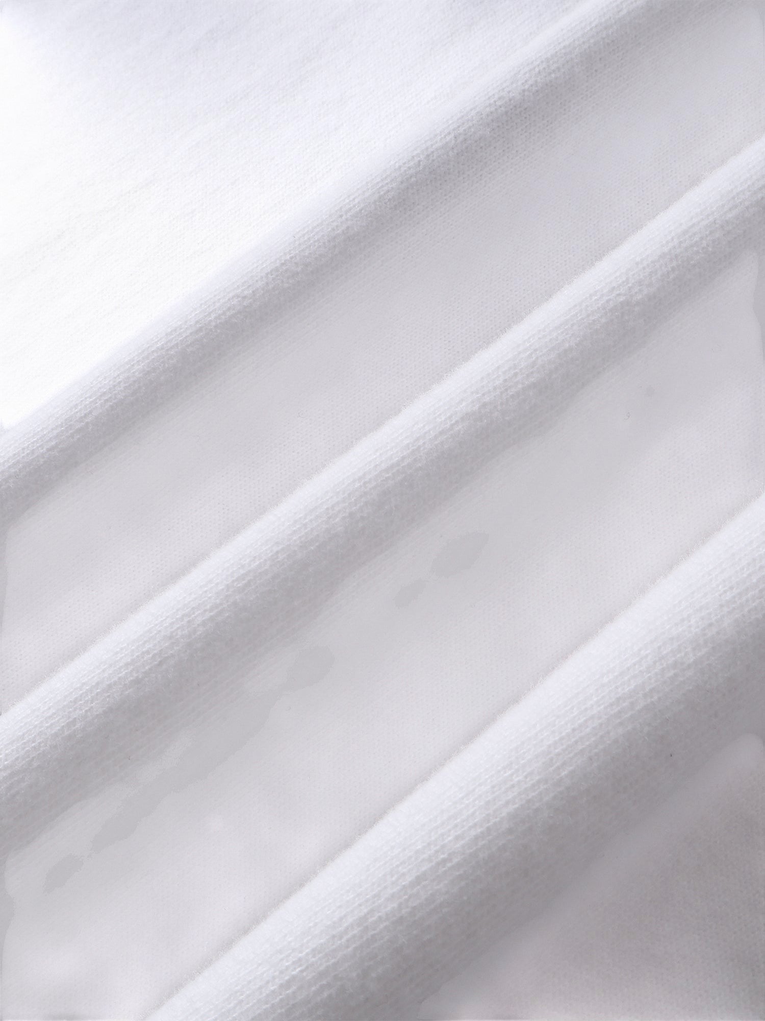 Close-up of the cotton texture on TBHNP white Knight & Sword tee — men's streetwear detail