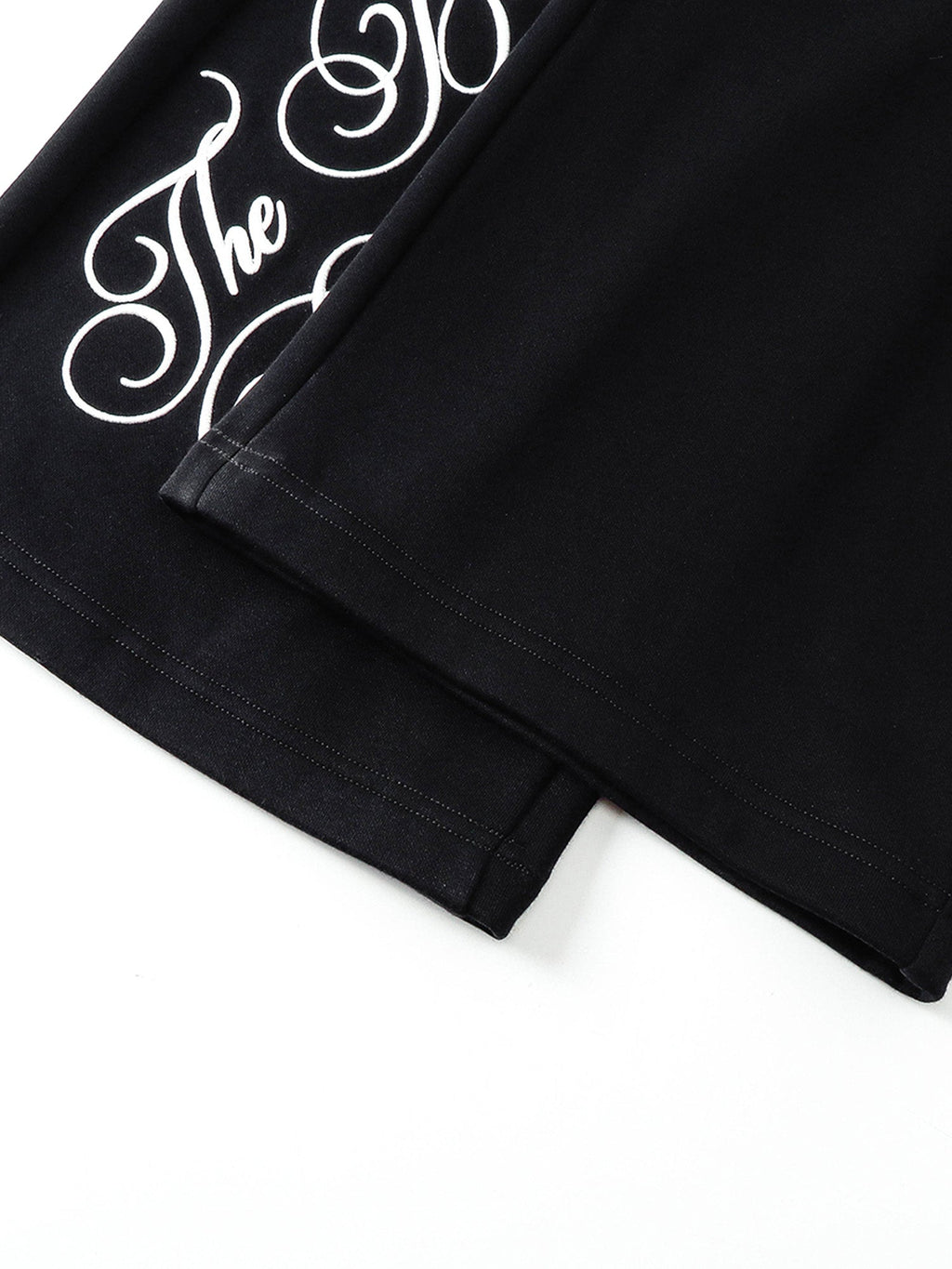 Full-length TBHNP script graphic and hem detail